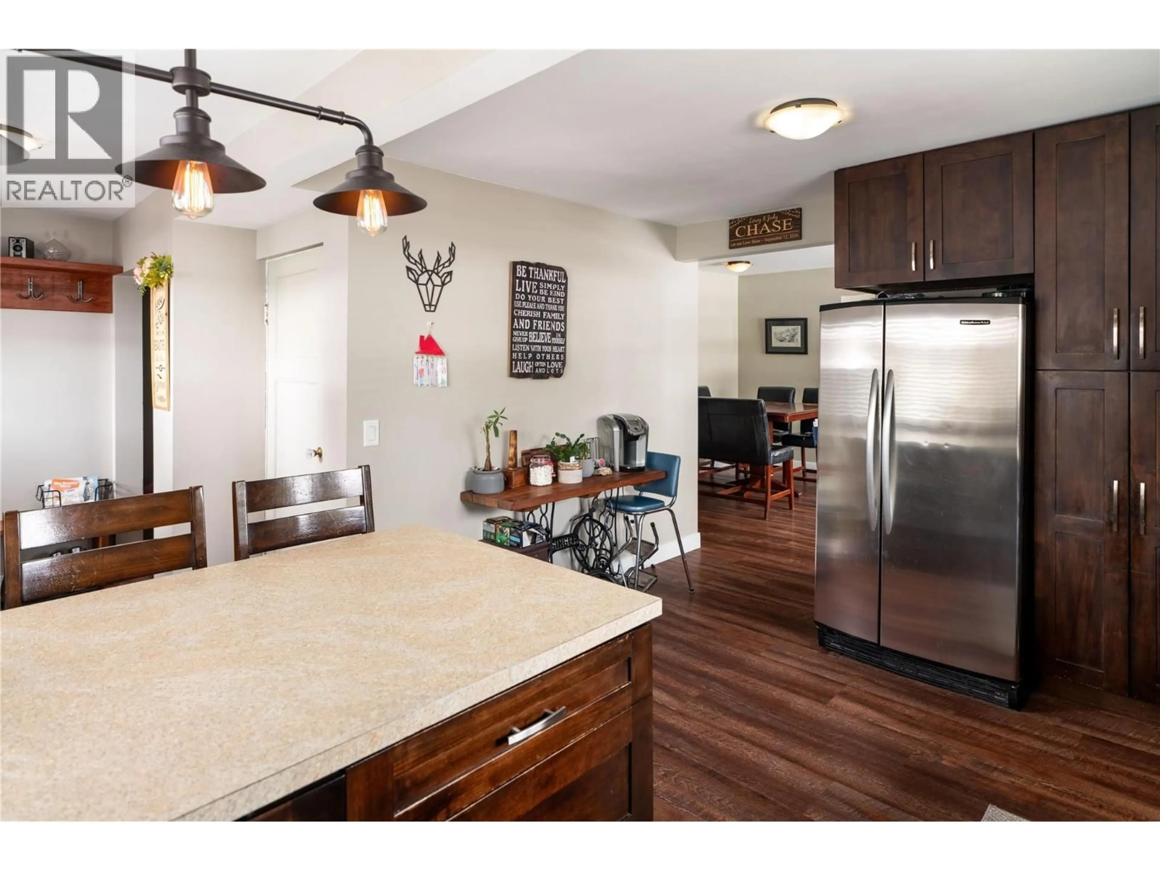 Open concept kitchen, wood/laminate floor for 170 MUGFORD ROAD, Kelowna British Columbia V1X2E2