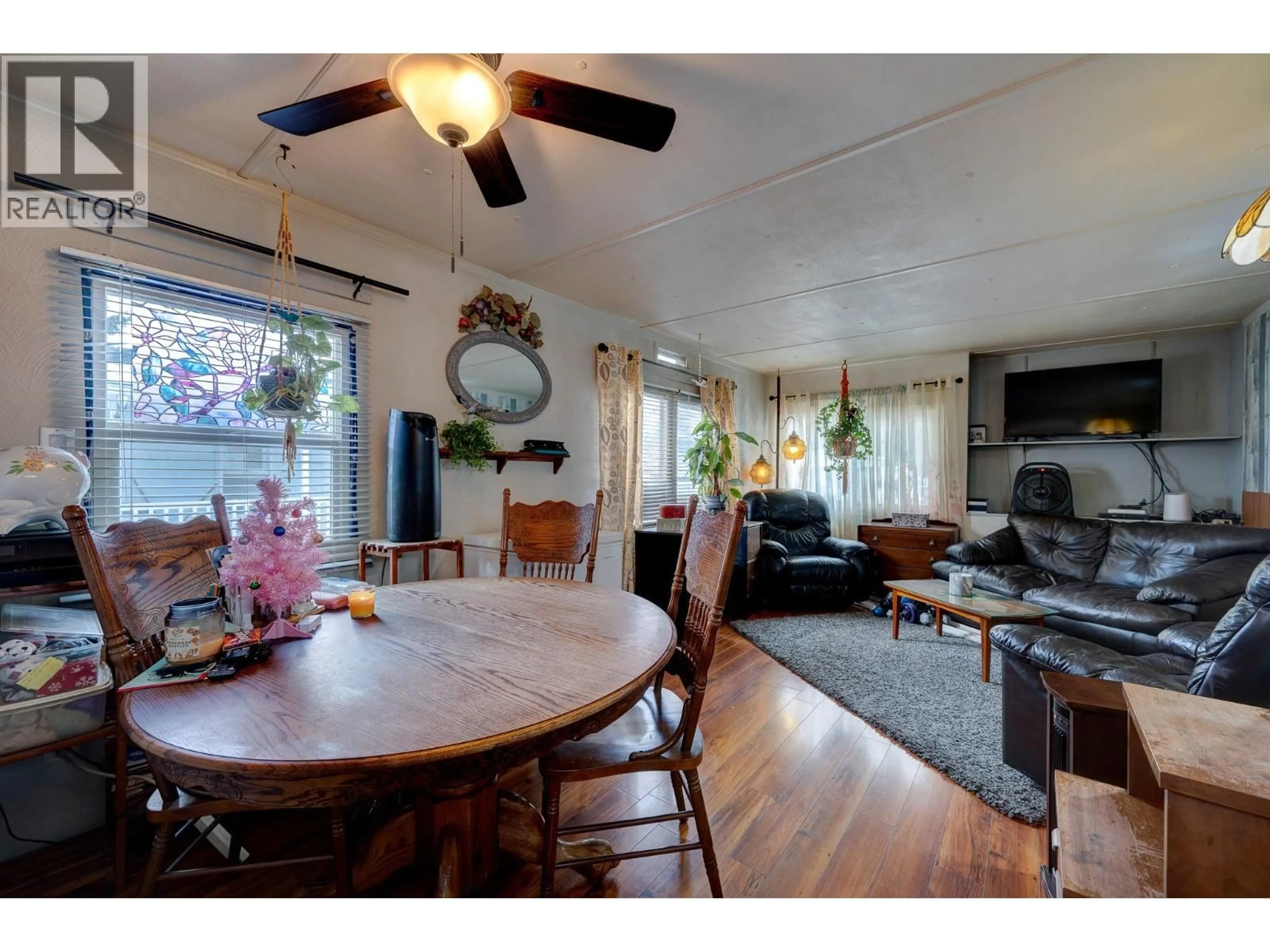 Living room with furniture, wood/laminate floor for 49 - 2401 ORD ROAD, Kamloops British Columbia V2C7V8