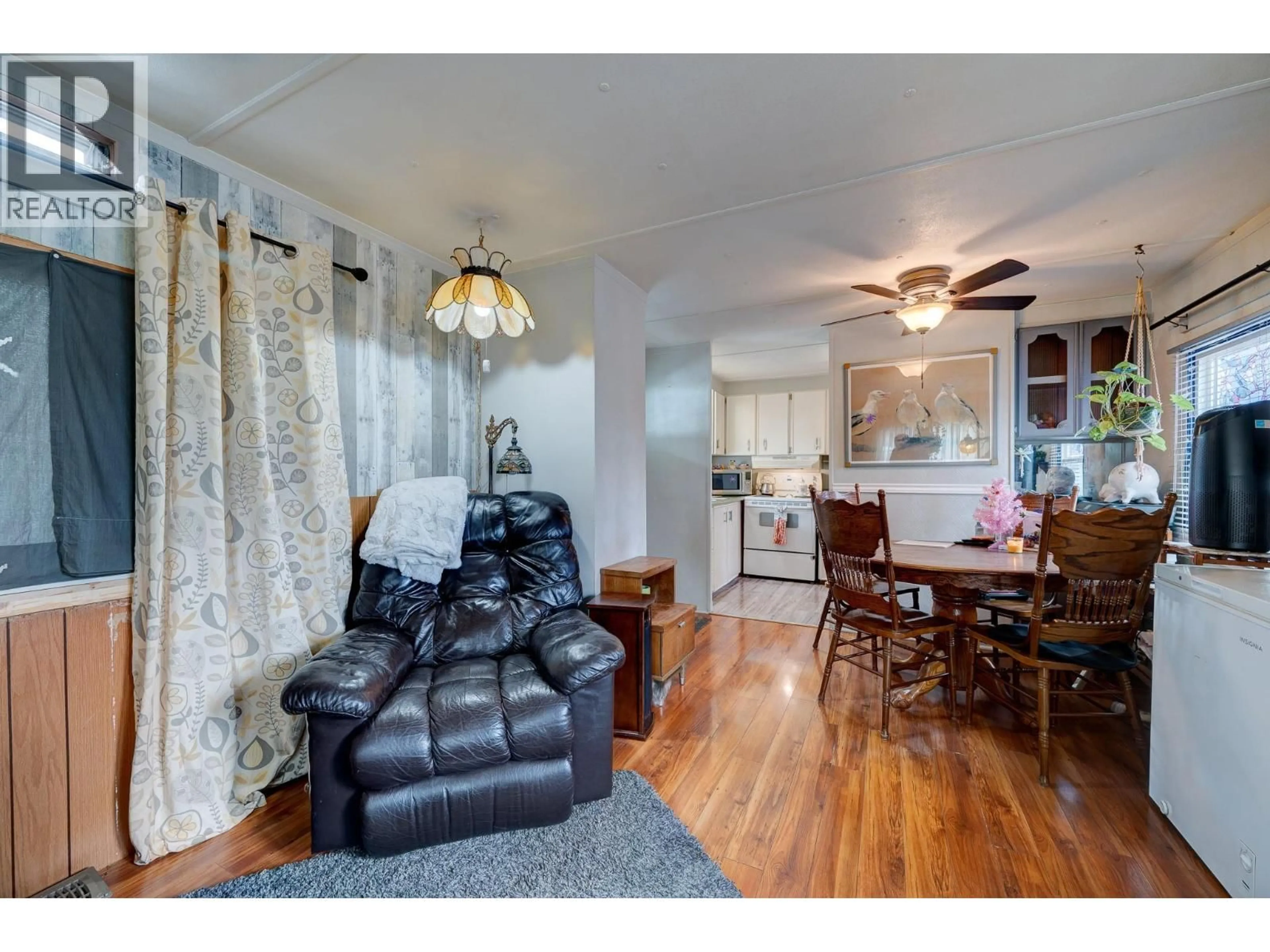 Living room with furniture, wood/laminate floor for 49 - 2401 ORD ROAD, Kamloops British Columbia V2C7V8