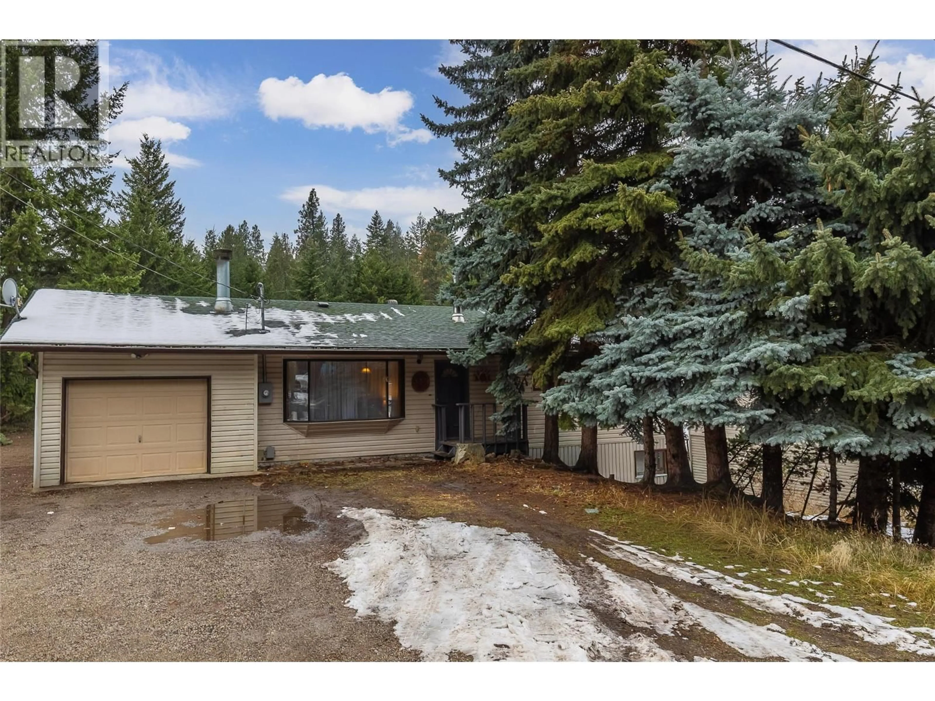 A pic from outside/outdoor area/front of a property/back of a property/a pic from drone, unknown for 327 EVERGREEN WAY, Vernon British Columbia V1H2B8