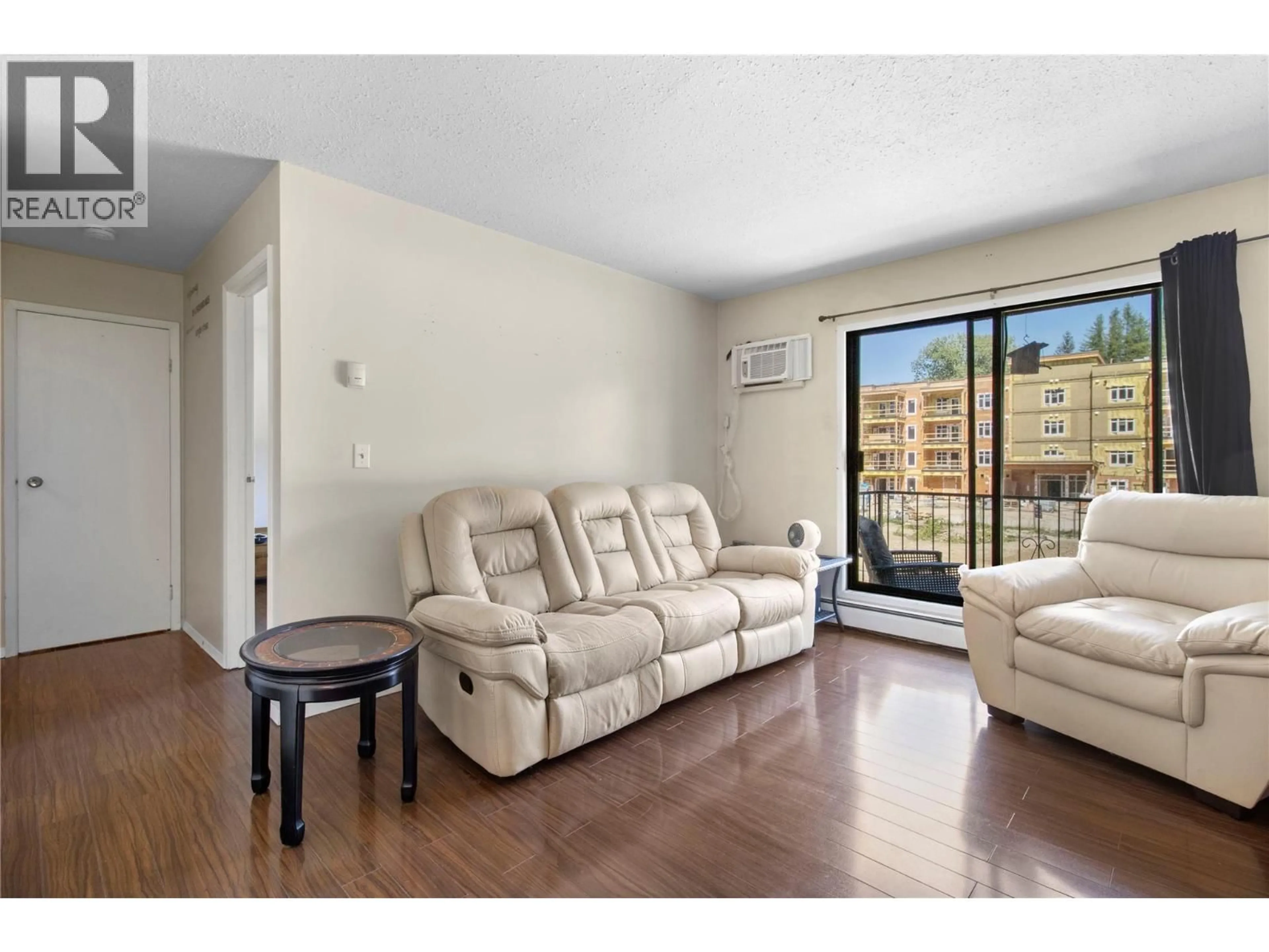 Living room with furniture, wood/laminate floor for 204 - 409 MAIN STREET, Sicamous British Columbia V0E2V0