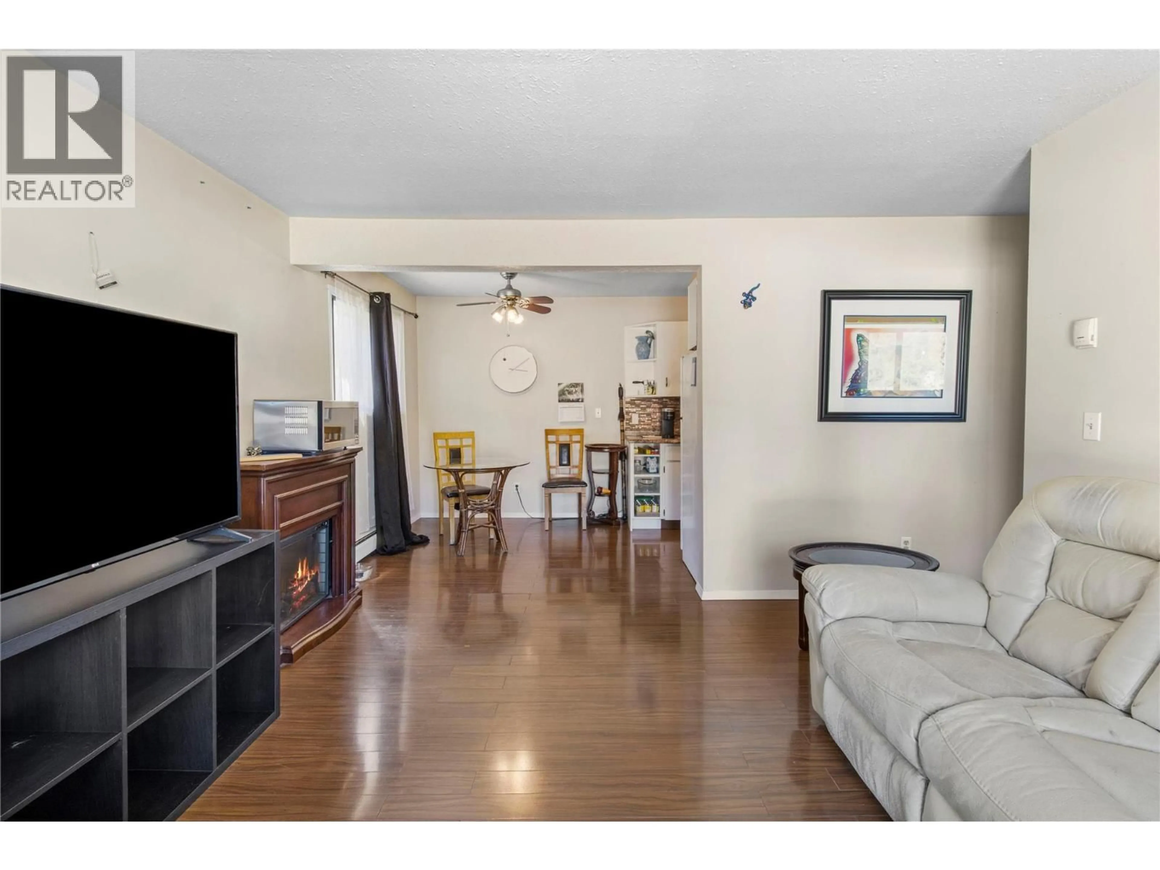 Living room with furniture, wood/laminate floor for 204 - 409 MAIN STREET, Sicamous British Columbia V0E2V0