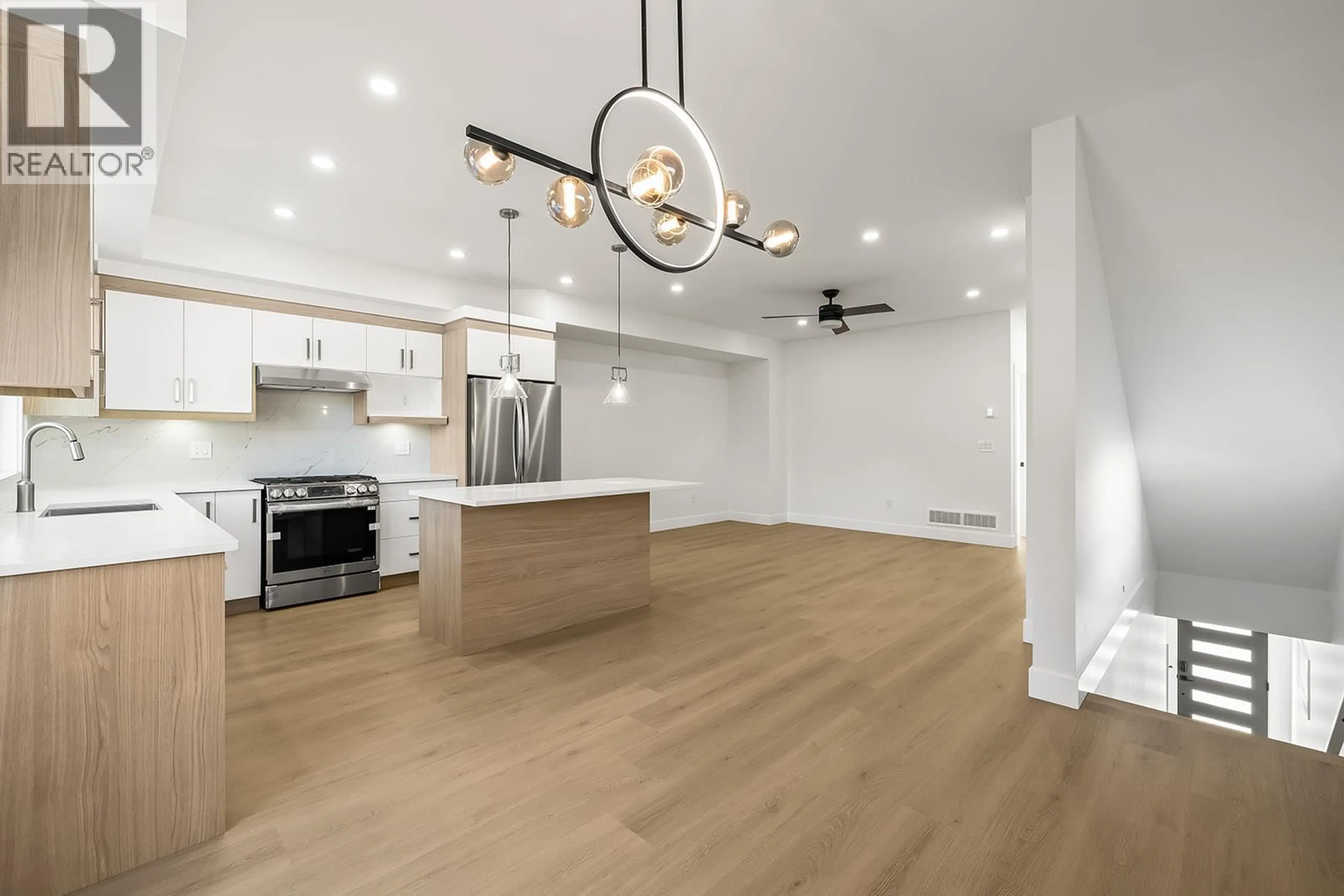 Open concept kitchen, wood/laminate floor for 2709 HEWL ROAD, West Kelowna British Columbia V1Z2M5