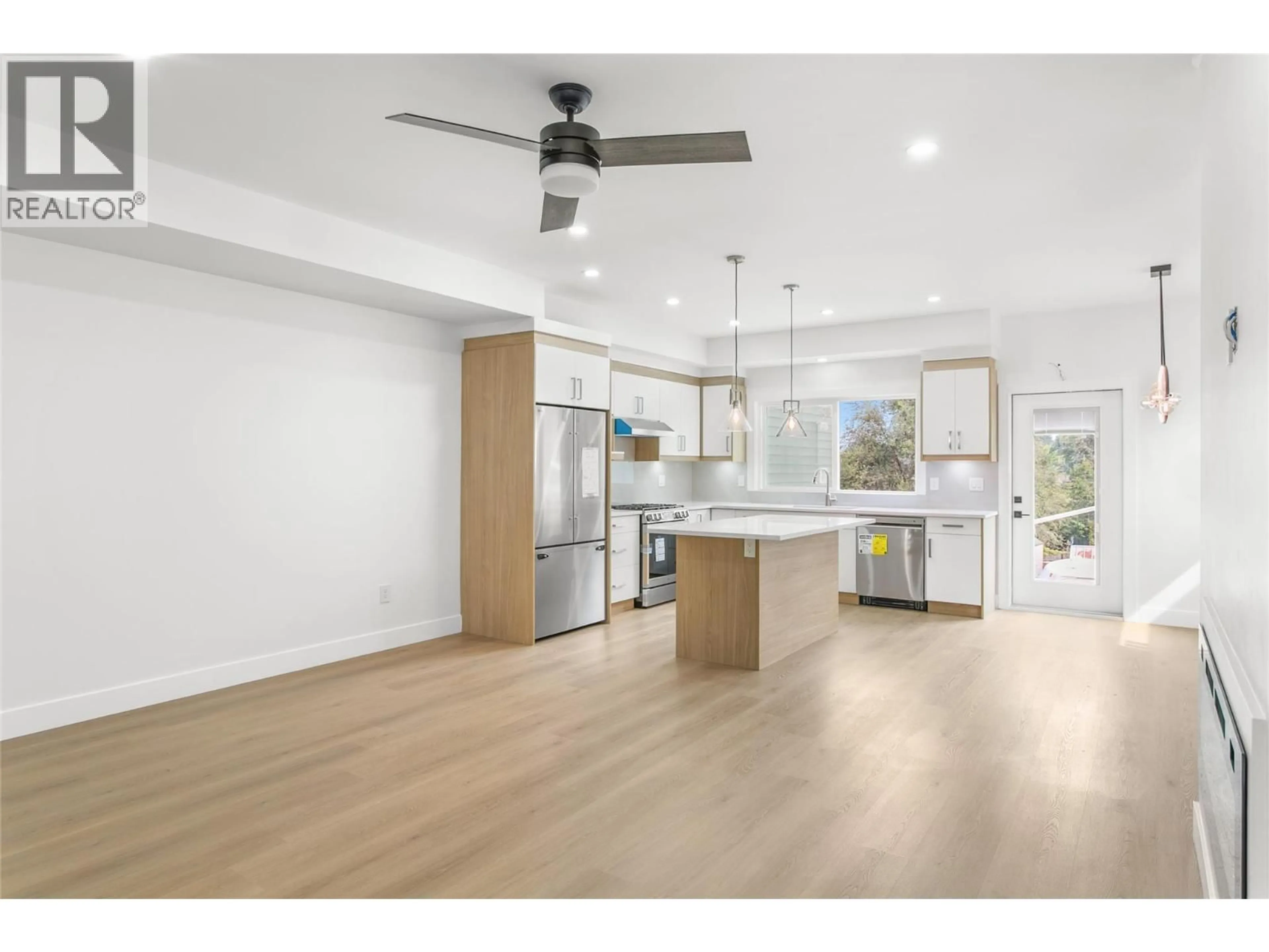 Open concept kitchen, wood/laminate floor for 2711 HEWL ROAD, West Kelowna British Columbia V1Z1N1