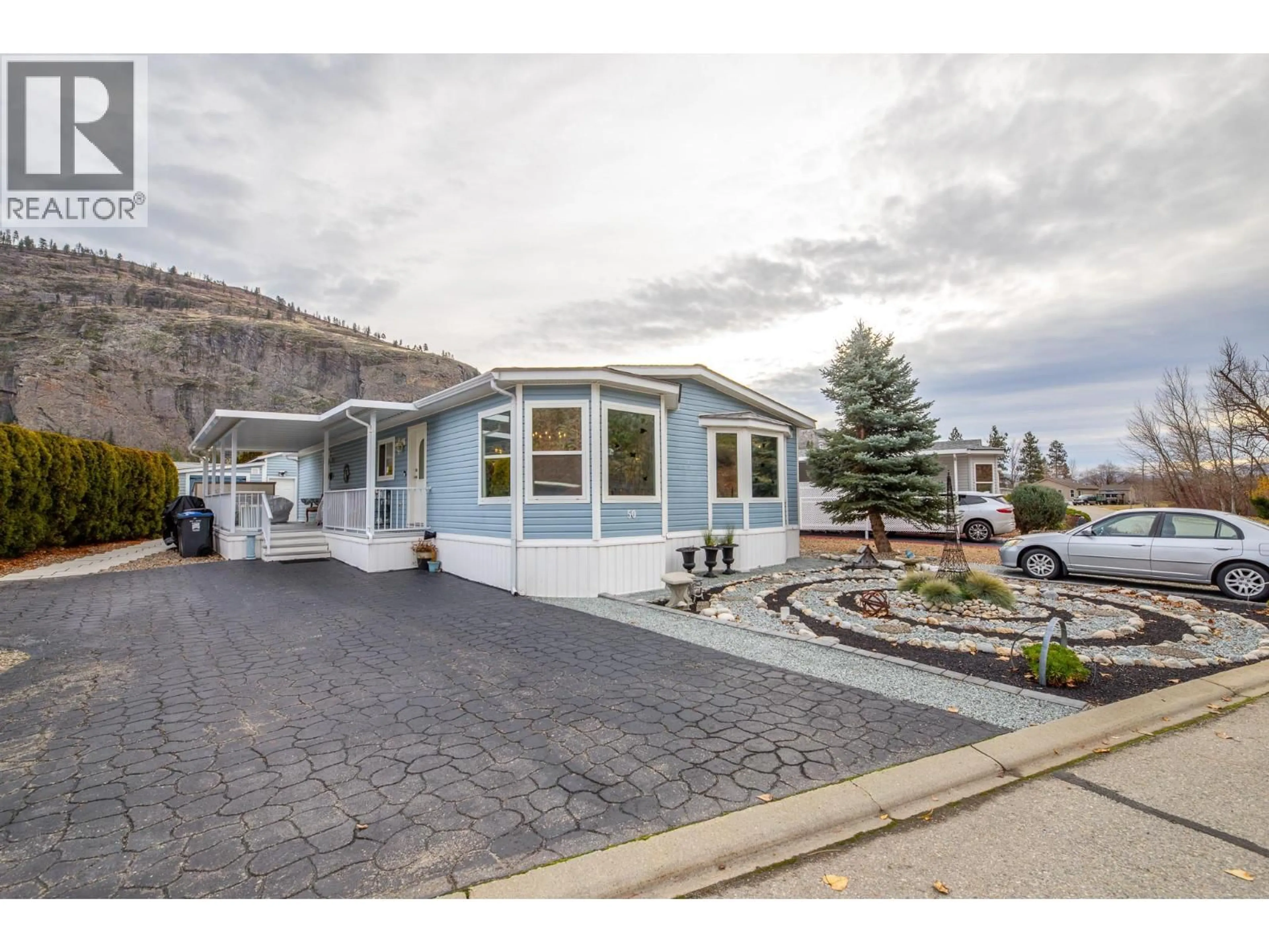 Home with vinyl exterior material, mountain view for 50 - 8598 HWY 97 OTHER, Oliver British Columbia V0H1T2