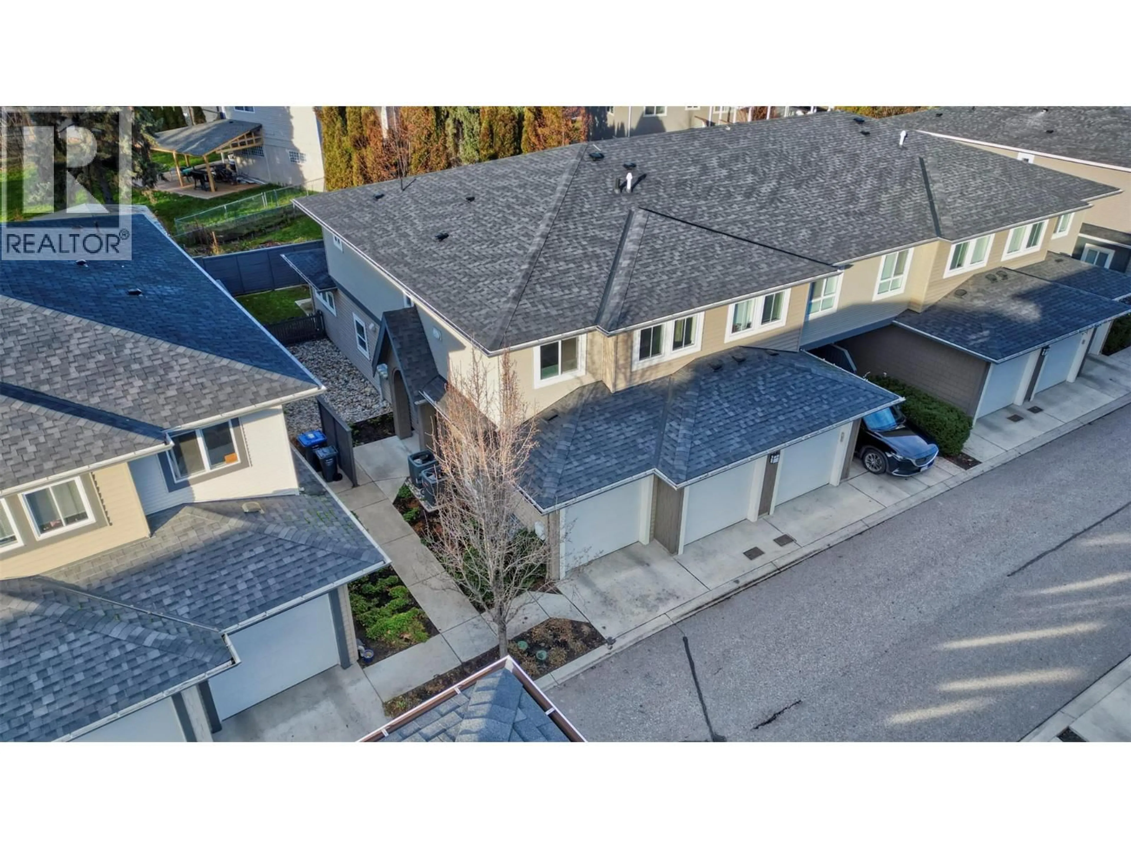 A pic from outside/outdoor area/front of a property/back of a property/a pic from drone, street for 76 - 680 OLD MEADOWS ROAD, Kelowna British Columbia V1W5L4