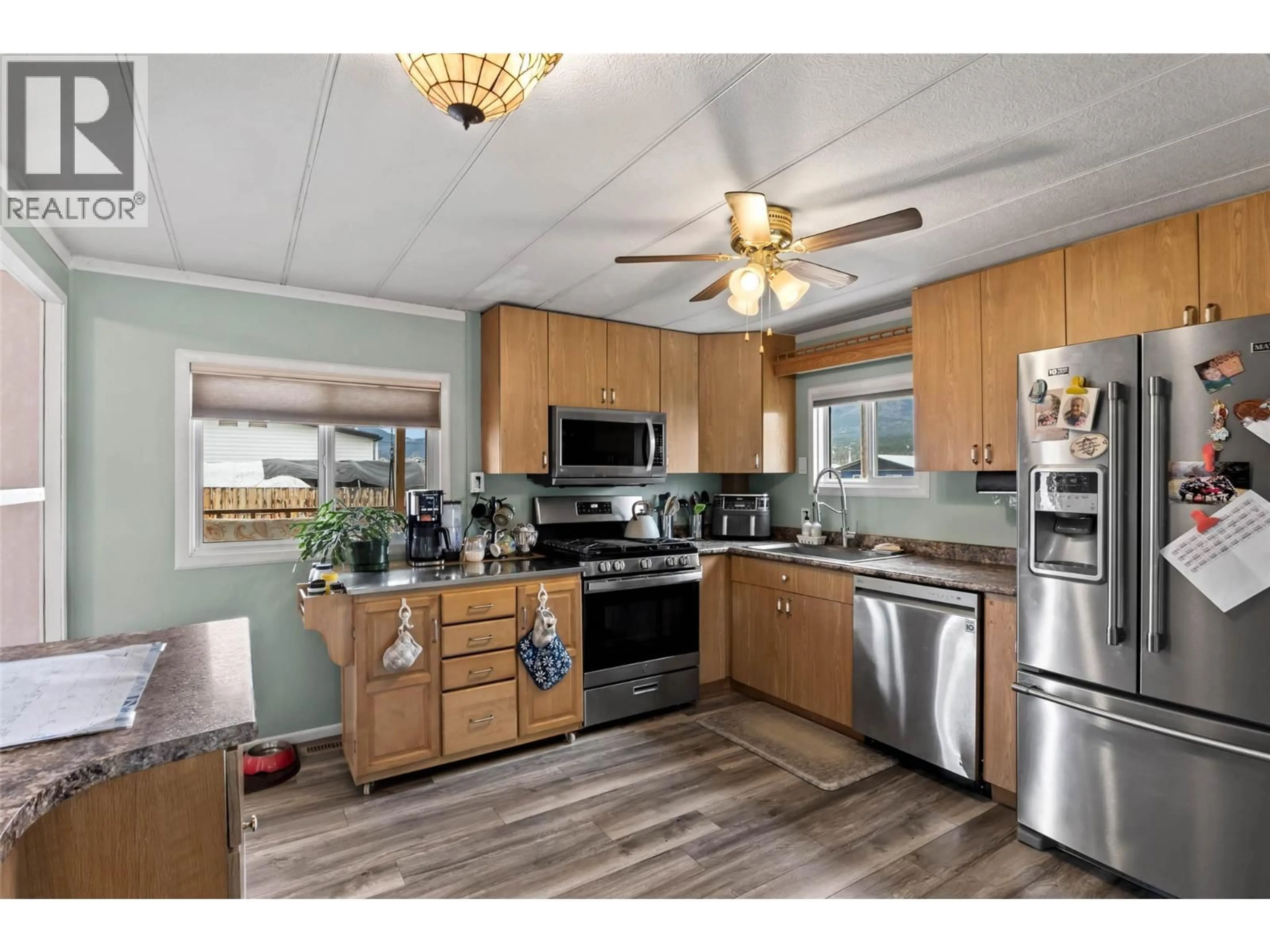 Open concept kitchen, wood/laminate floor for 4945 ANKER ROAD, Pritchard British Columbia V0E2P0