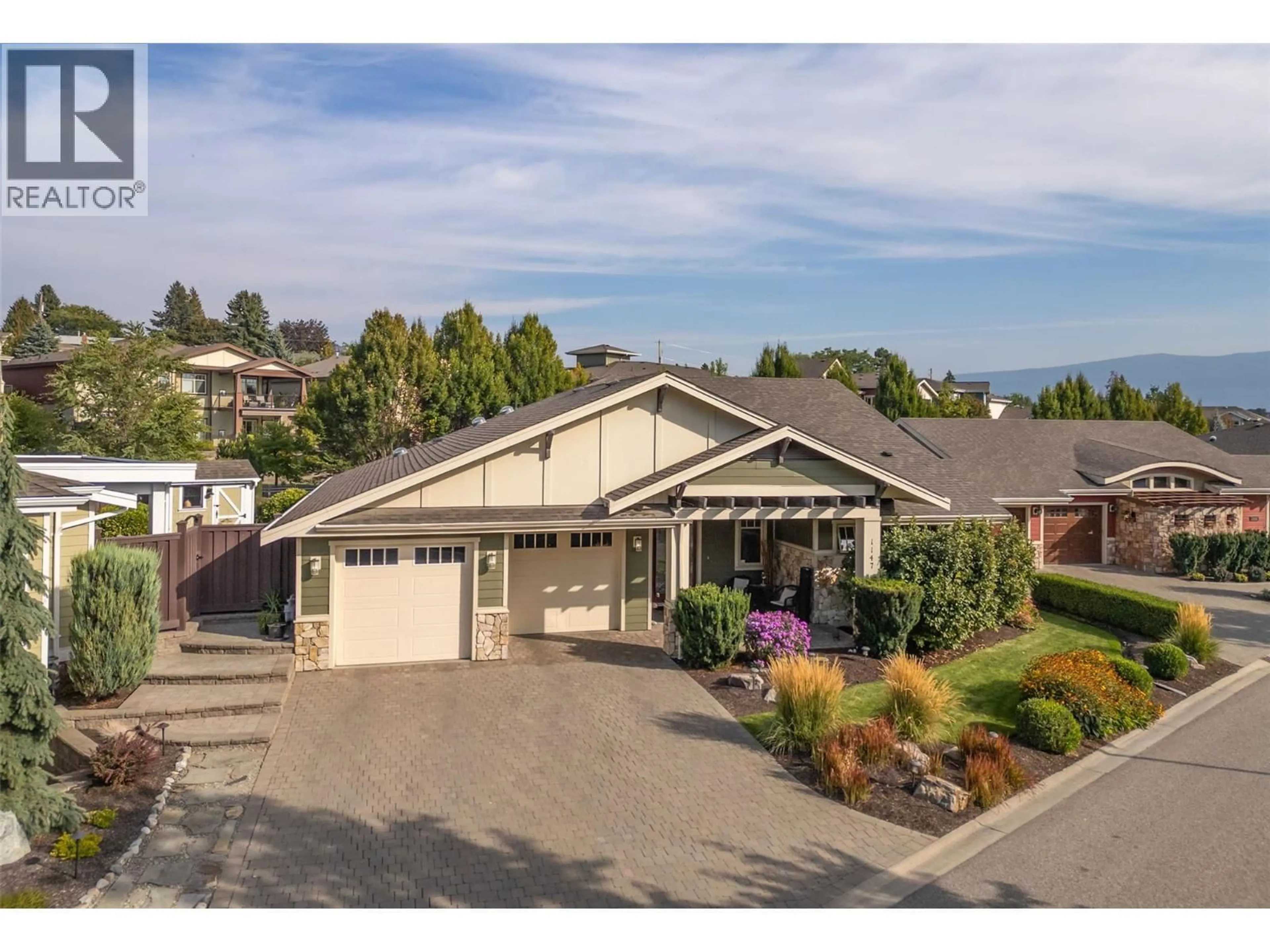 A pic from outside/outdoor area/front of a property/back of a property/a pic from drone, mountain view for 1147 GLENVIEW COURT, Kelowna British Columbia V1Y0A7