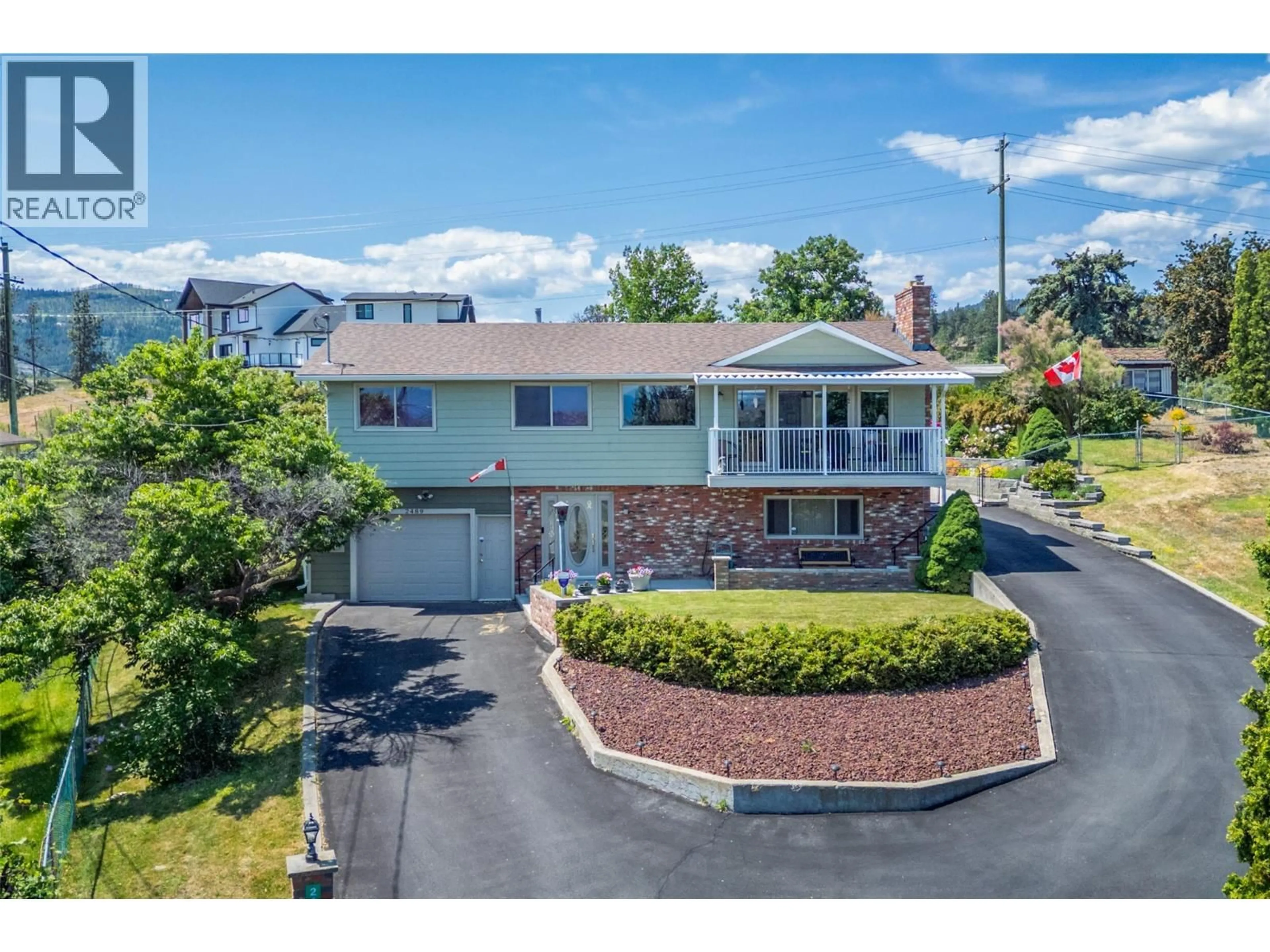 A pic from outside/outdoor area/front of a property/back of a property/a pic from drone, street for 2489 CHIEFTAIN ROAD, West Kelowna British Columbia V4T1N3