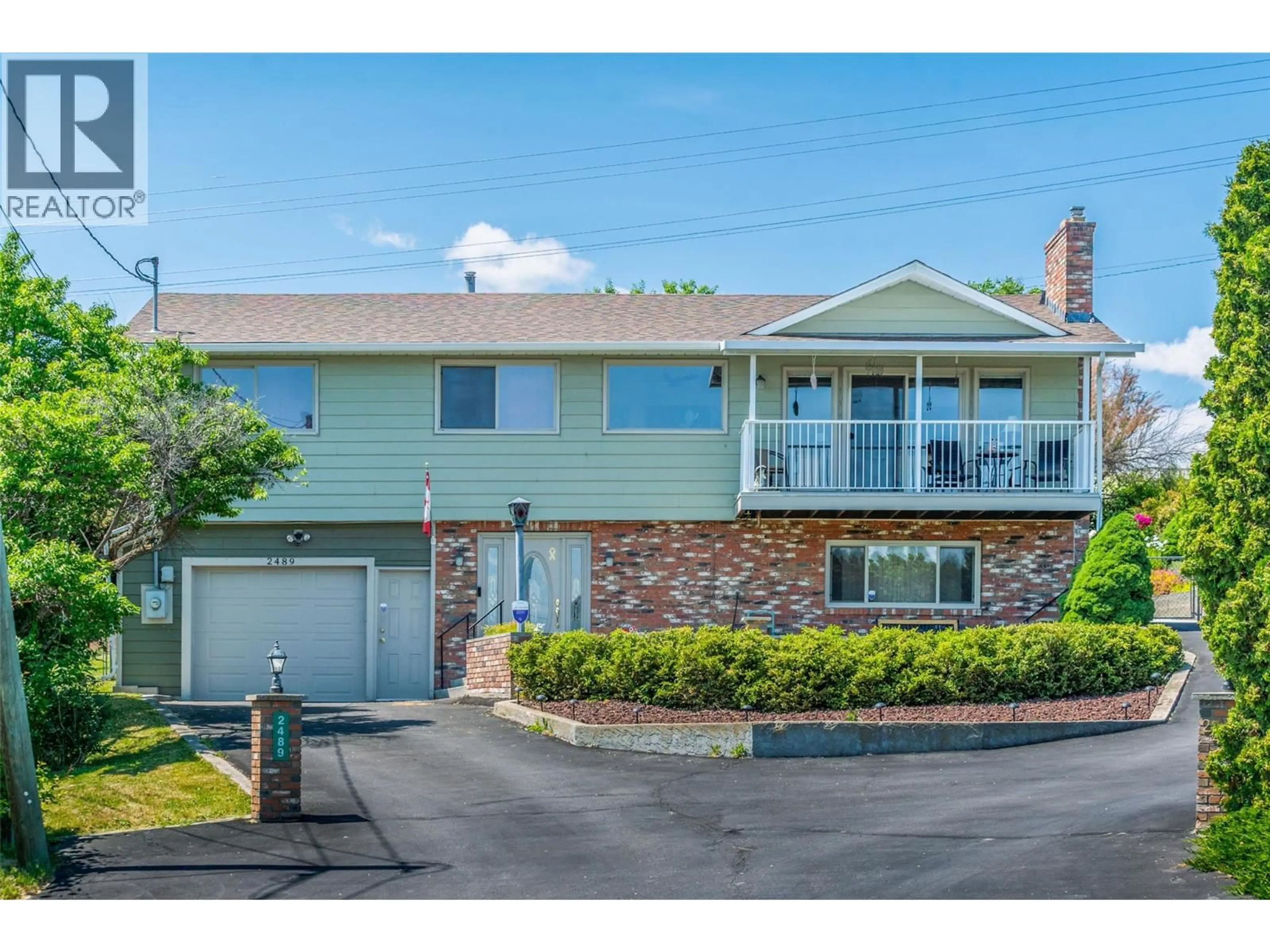 Home with vinyl exterior material, street for 2489 CHIEFTAIN ROAD, West Kelowna British Columbia V4T1N3