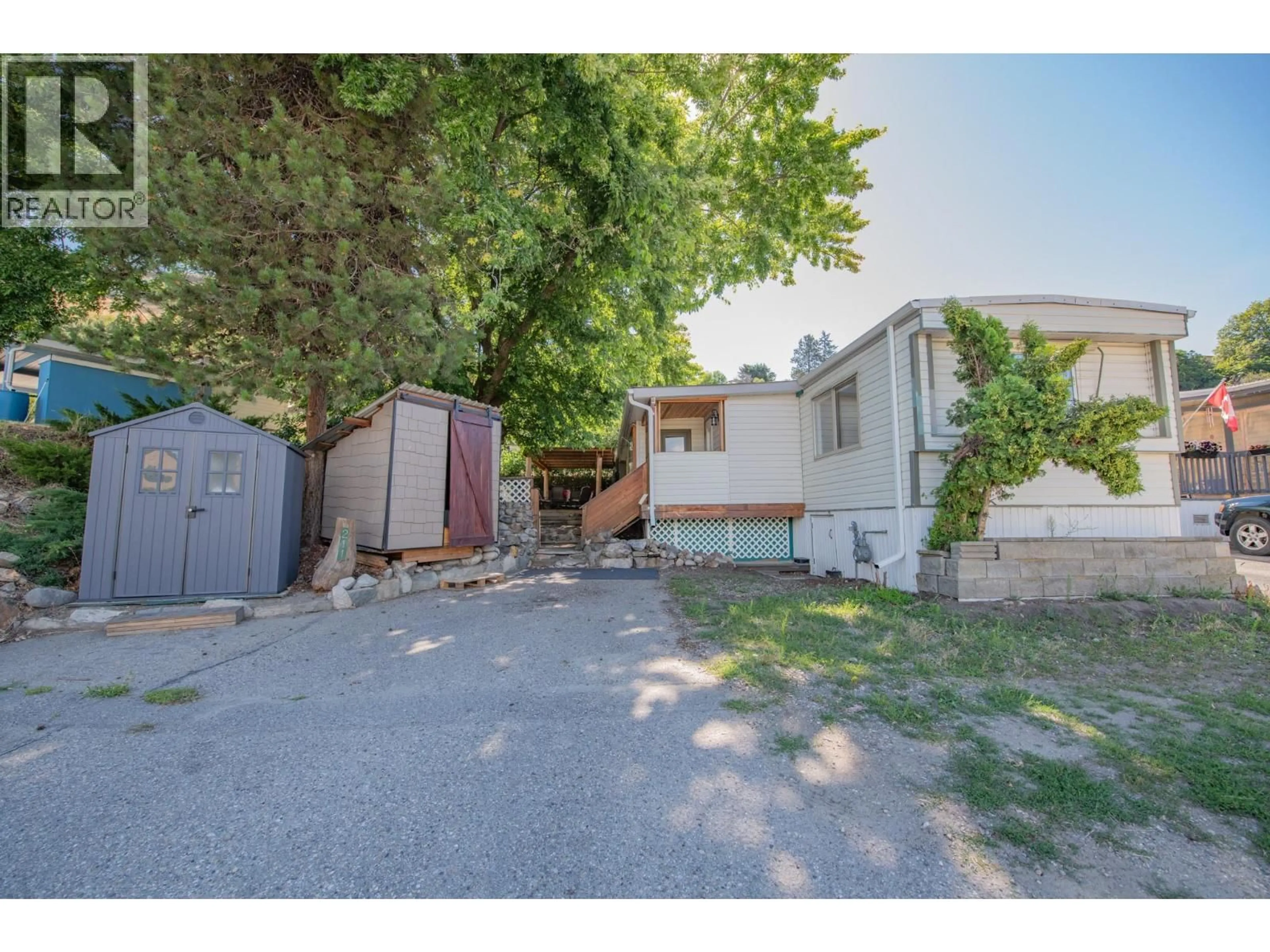 A pic from outside/outdoor area/front of a property/back of a property/a pic from drone, street for 211 - 15401 KALAMALKA ROAD, Coldstream British Columbia V1B1Z3