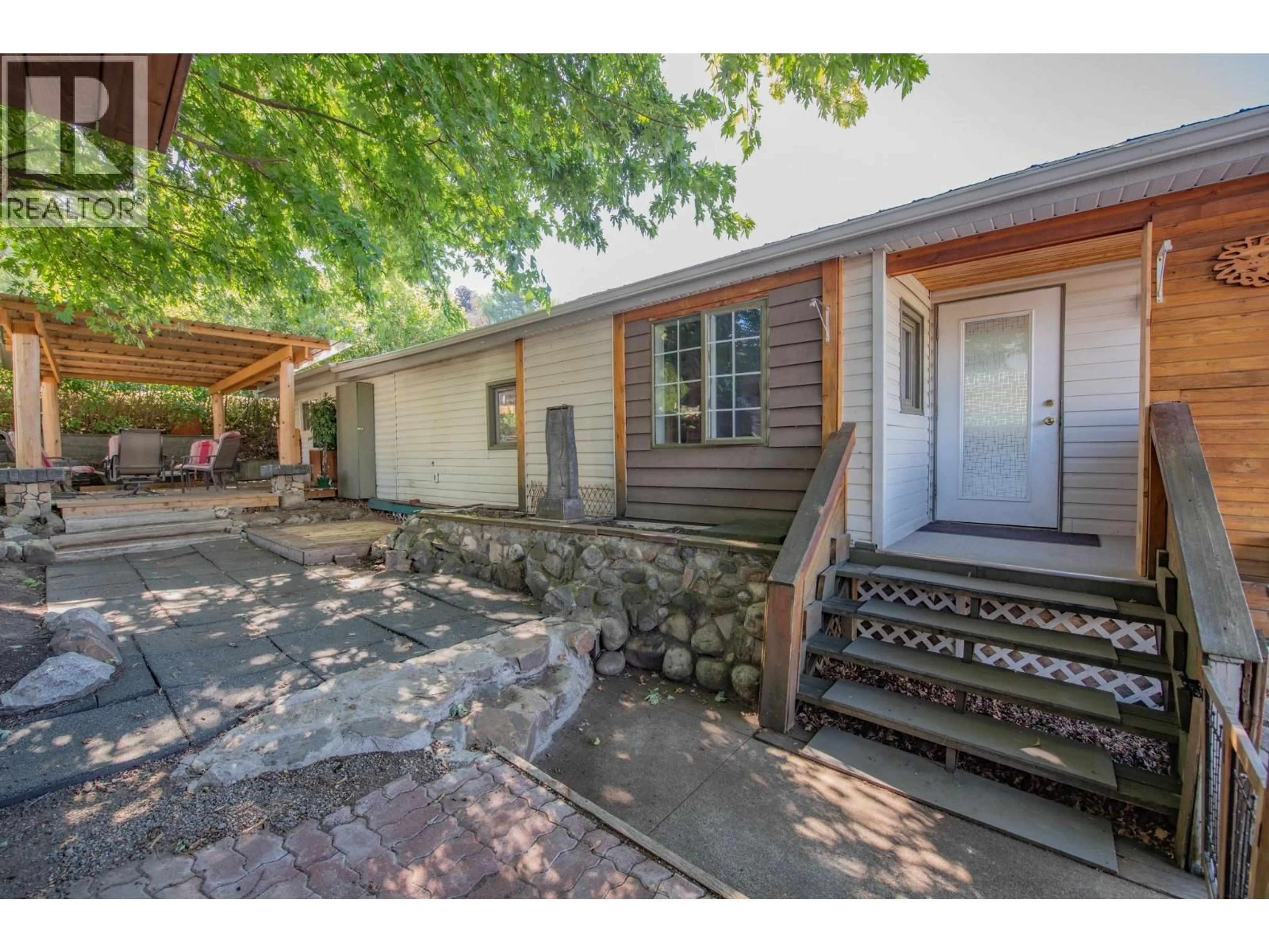 A pic from outside/outdoor area/front of a property/back of a property/a pic from drone, street for 211 - 15401 KALAMALKA ROAD, Coldstream British Columbia V1B1Z3