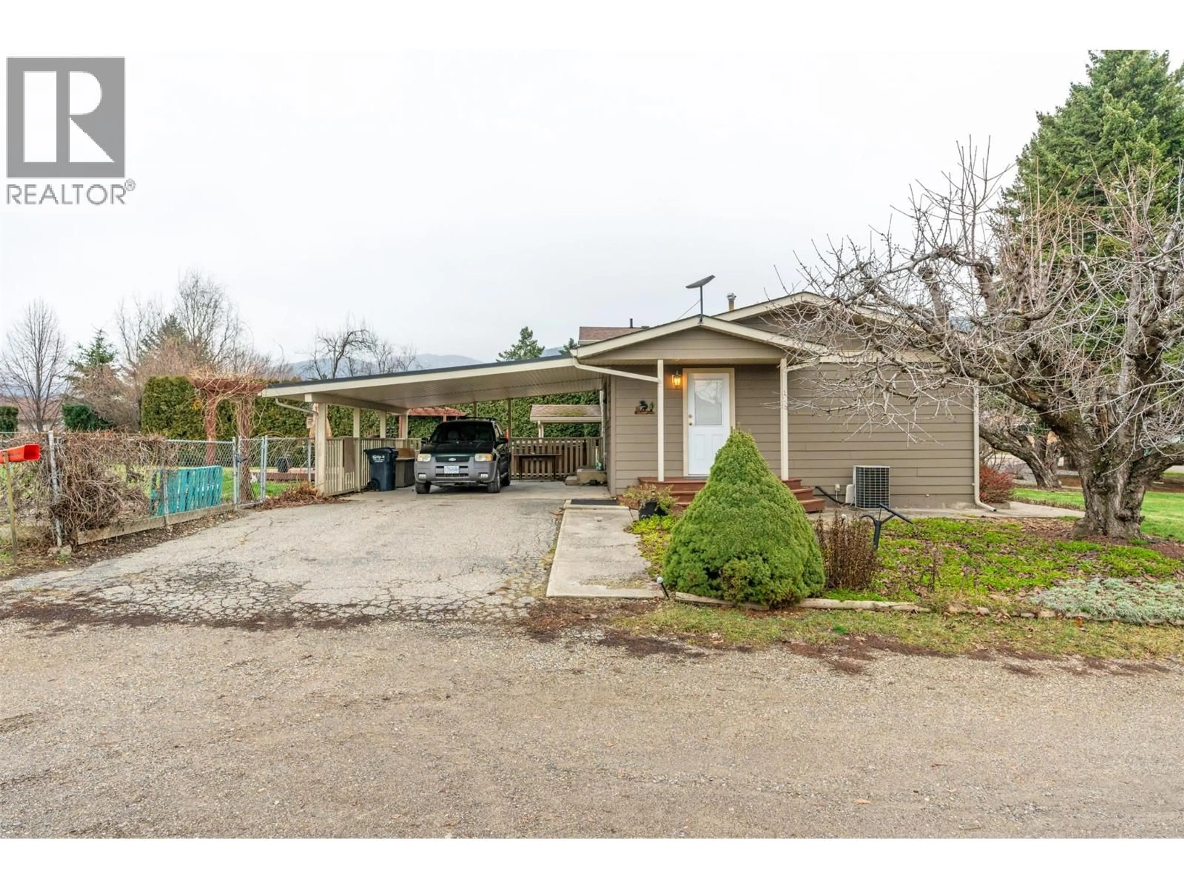 A pic from outside/outdoor area/front of a property/back of a property/a pic from drone, street for 5207 ALAIN ROAD, Vernon British Columbia V1B3K6