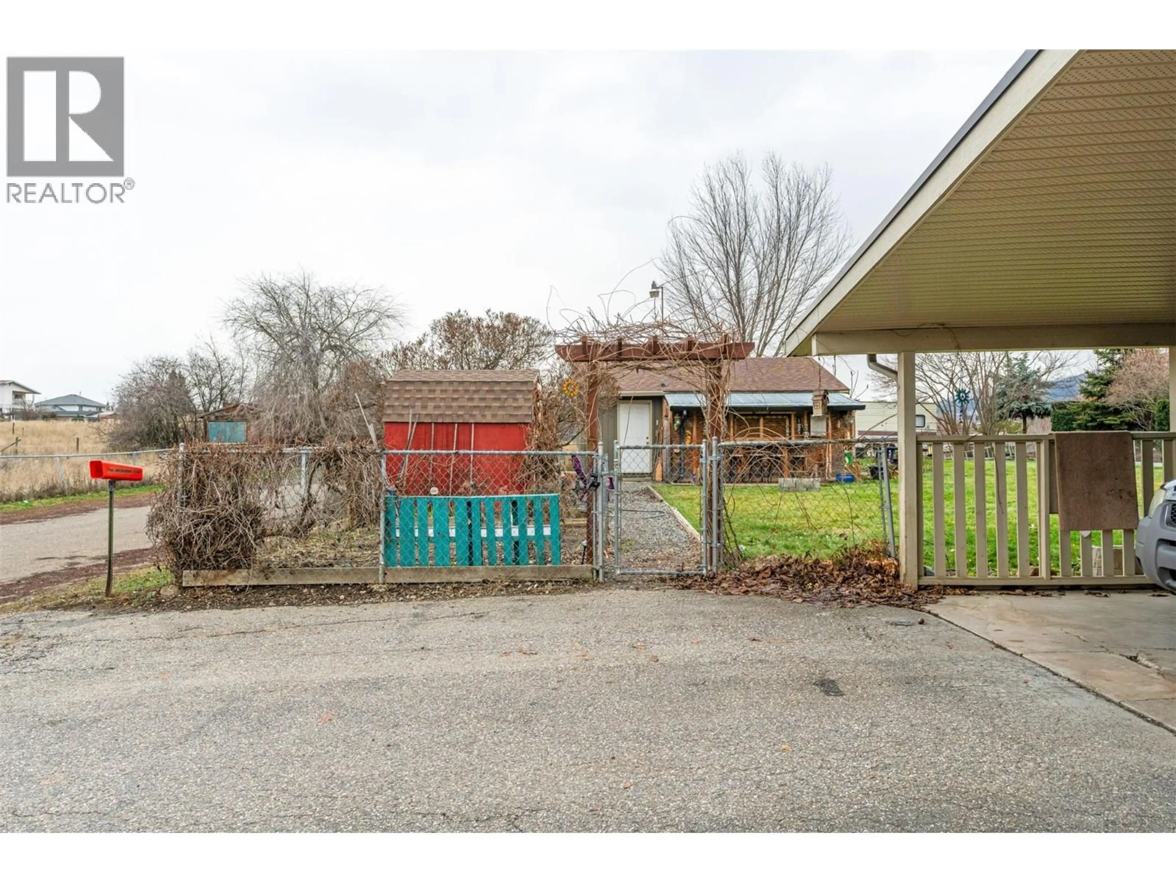 A pic from outside/outdoor area/front of a property/back of a property/a pic from drone, street for 5207 ALAIN ROAD, Vernon British Columbia V1B3K6