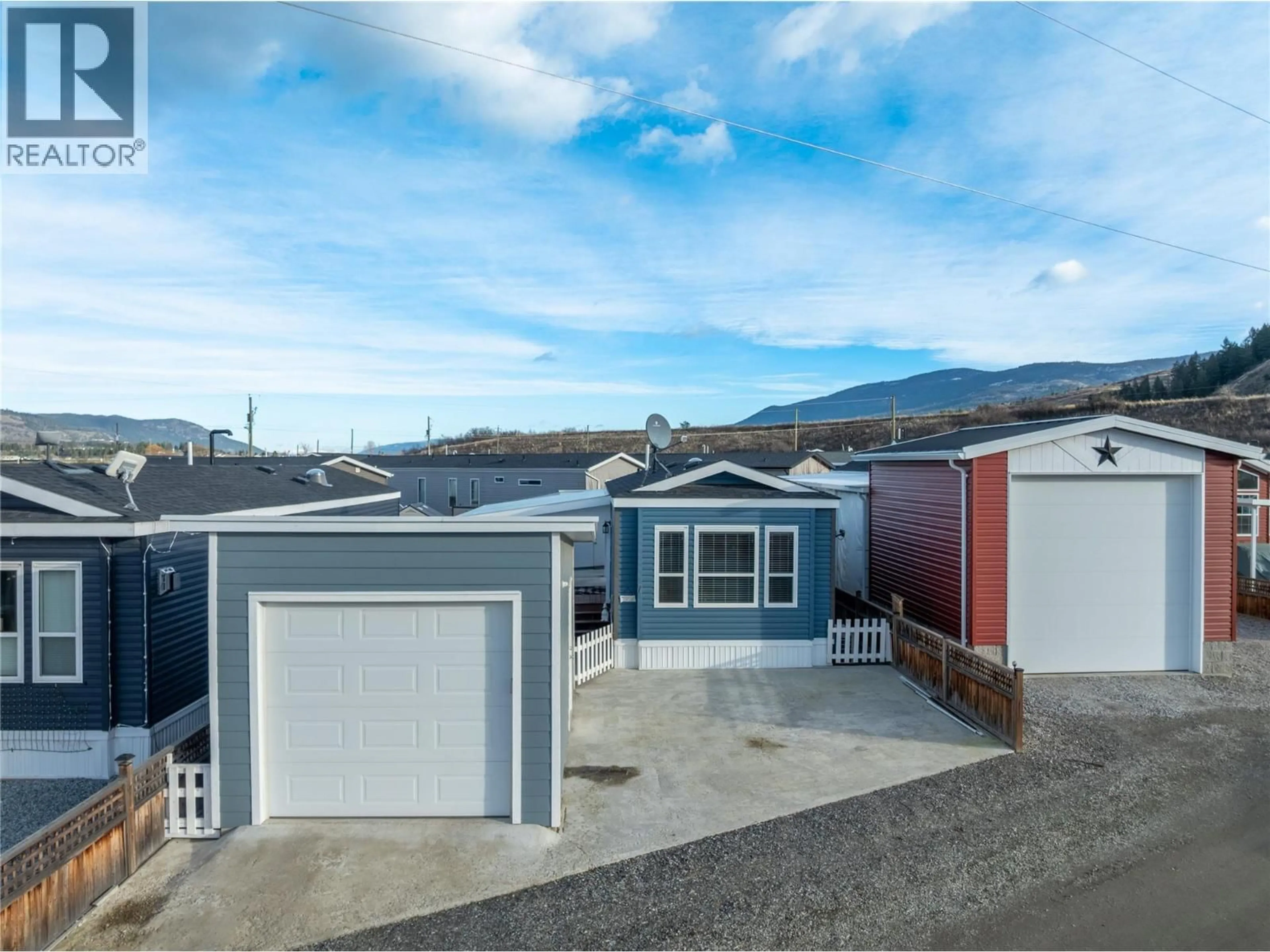 A pic from outside/outdoor area/front of a property/back of a property/a pic from drone, street for 7 - 65 ANTOINE ROAD, Vernon British Columbia V1H2A3