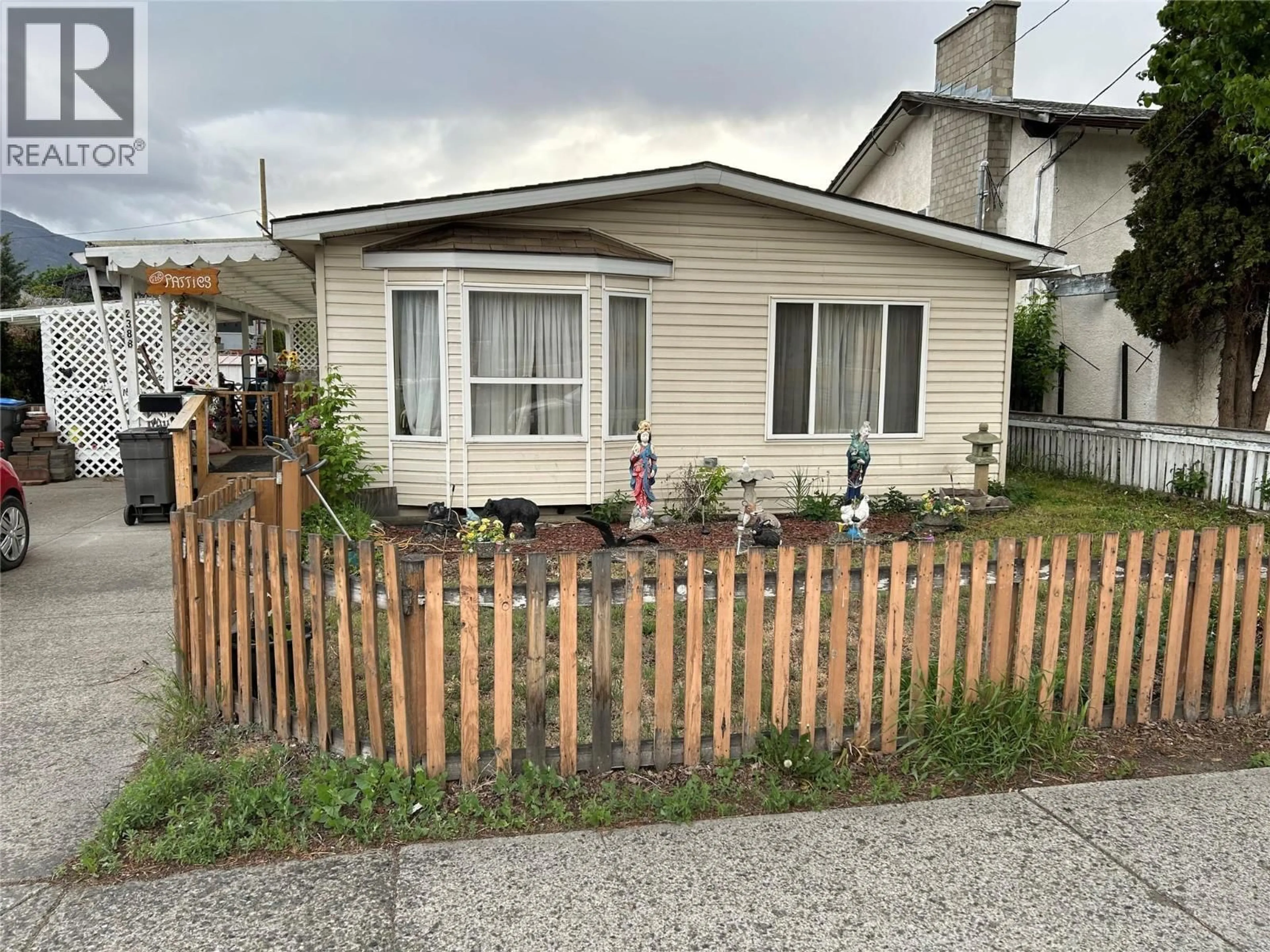 Home with vinyl exterior material, street for 2388 QUILCHENA AVENUE, Merritt British Columbia V1K1B8