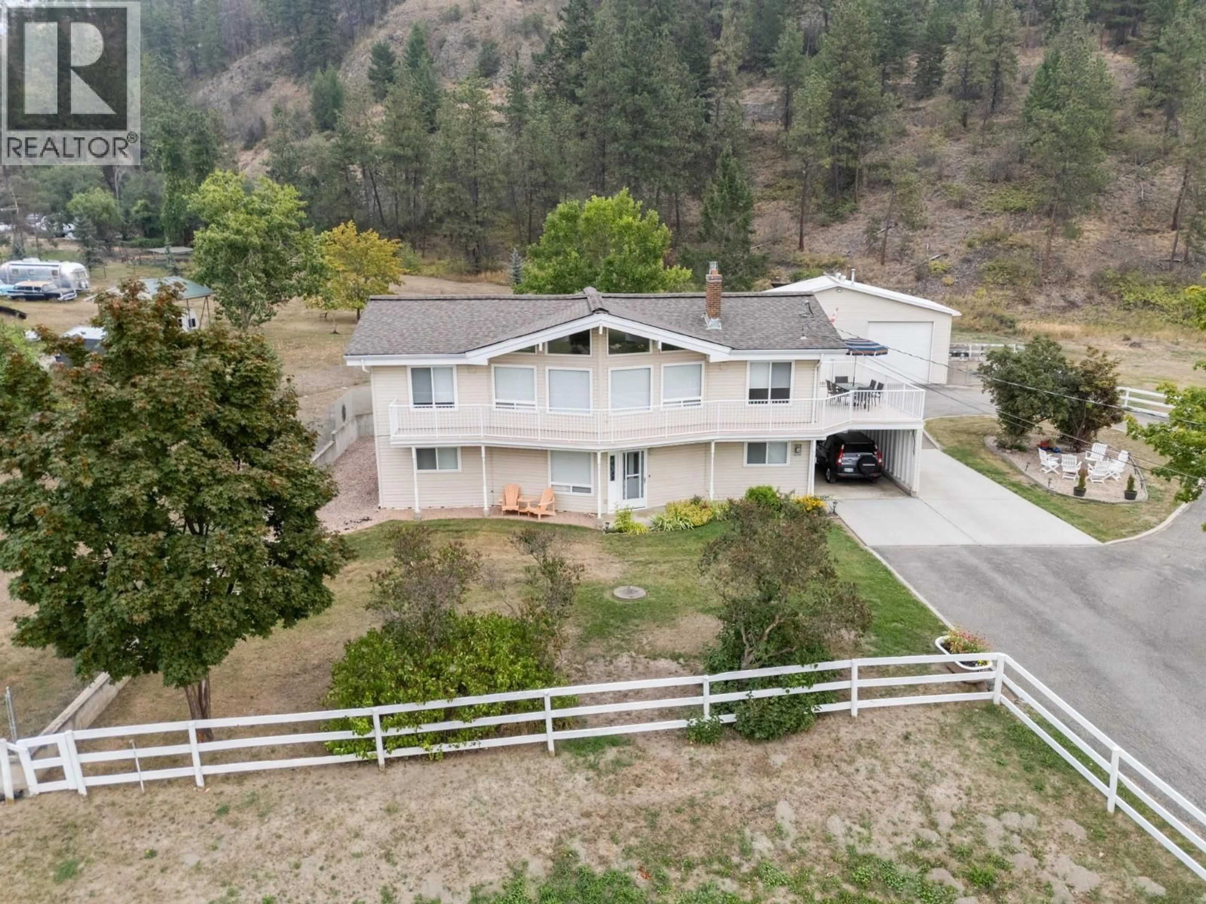 A pic from outside/outdoor area/front of a property/back of a property/a pic from drone, mountain view for 535 CURTIS ROAD, Kelowna British Columbia V1V2G6