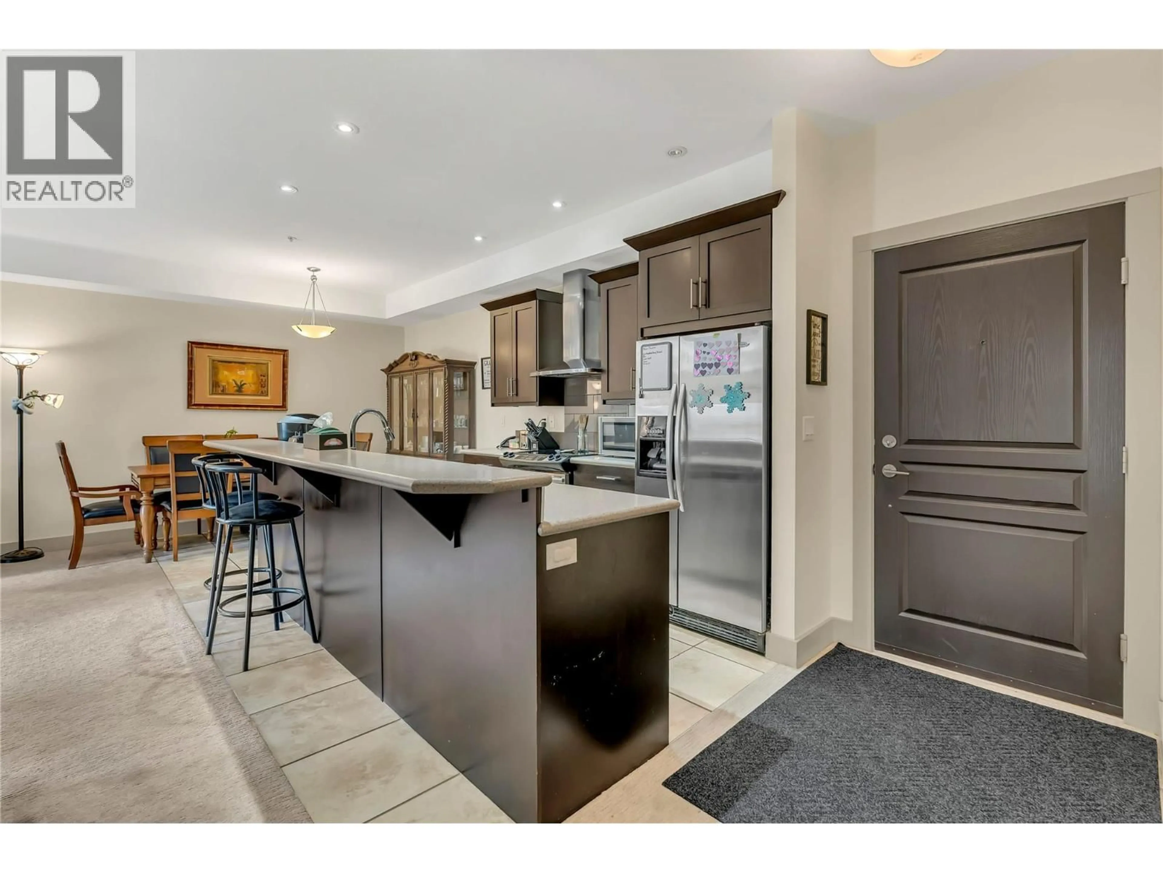 Open concept kitchen, ceramic/tile floor for 208 - 250 WATERFORD AVENUE, Penticton British Columbia V2A3T8