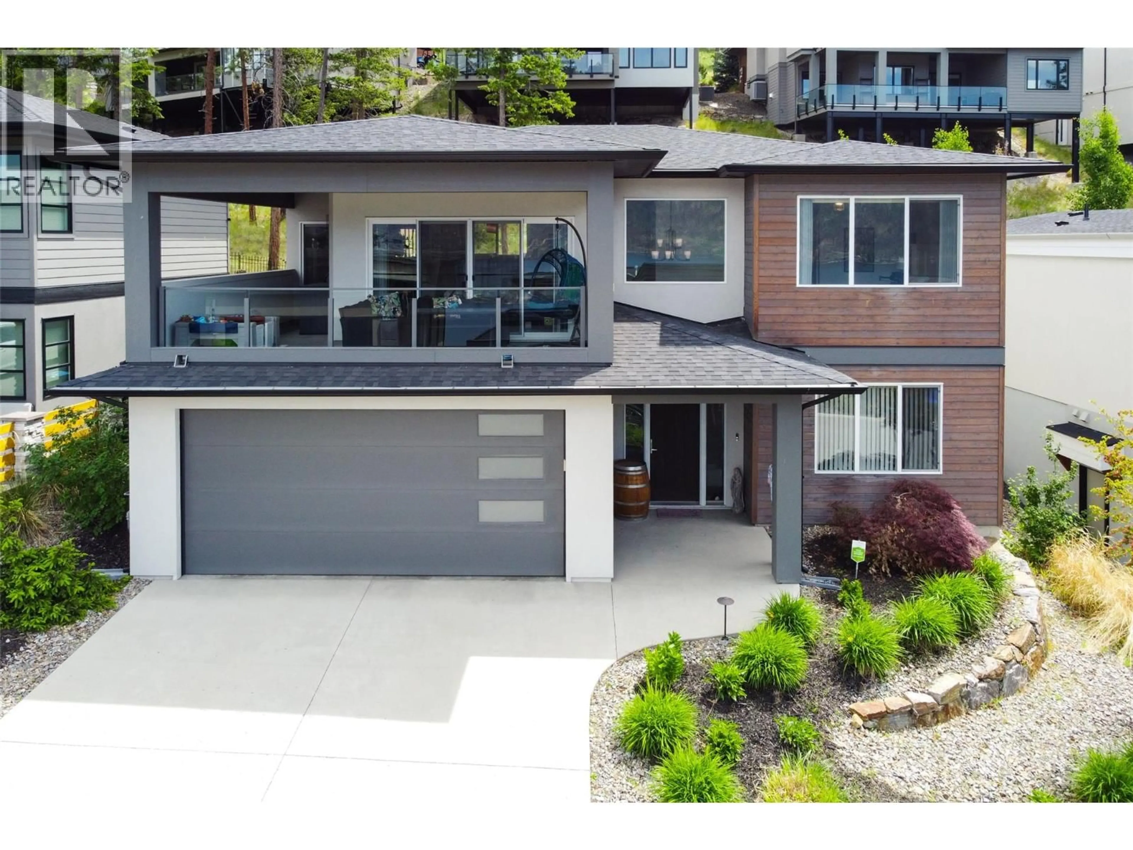 A pic from outside/outdoor area/front of a property/back of a property/a pic from drone, street for 3411 WATER BIRCH CIRCLE CIRCLE, Kelowna British Columbia V1V3G1