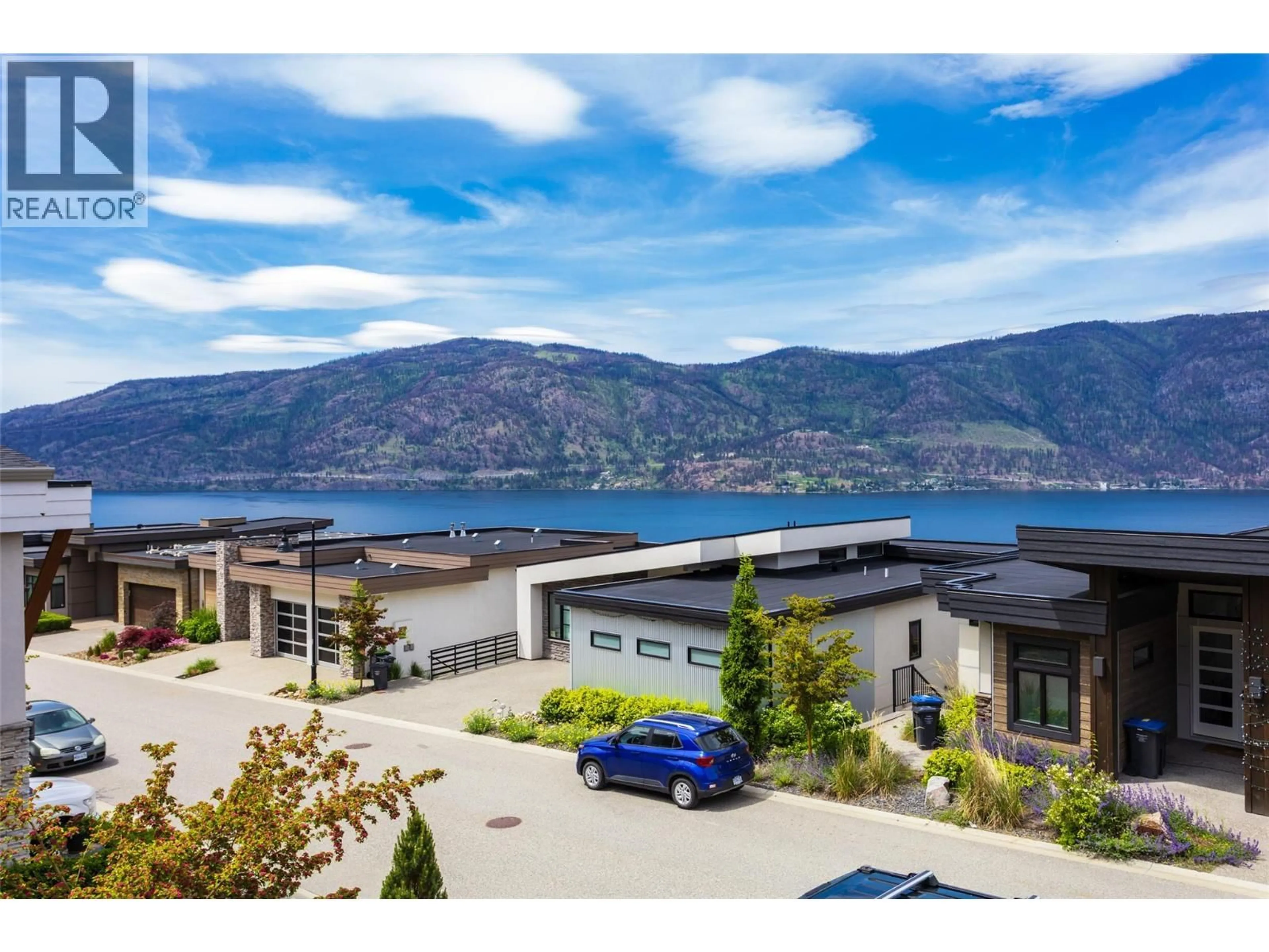 A pic from outside/outdoor area/front of a property/back of a property/a pic from drone, water/lake/river/ocean view for 3411 WATER BIRCH CIRCLE CIRCLE, Kelowna British Columbia V1V3G1