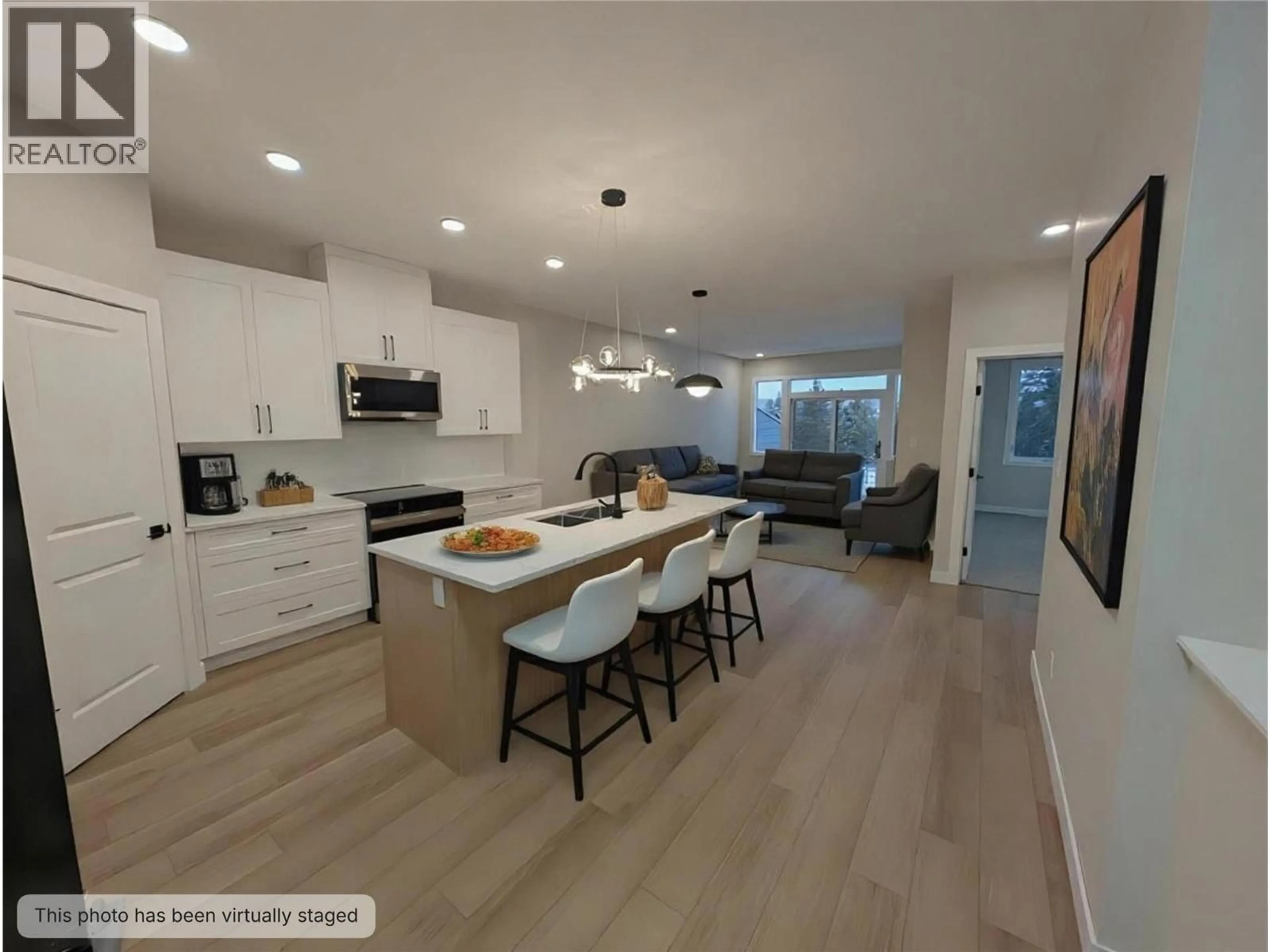 Open concept kitchen, wood/laminate floor for 7114 MORGAN LANE, Radium Hot Springs British Columbia V0A1M0