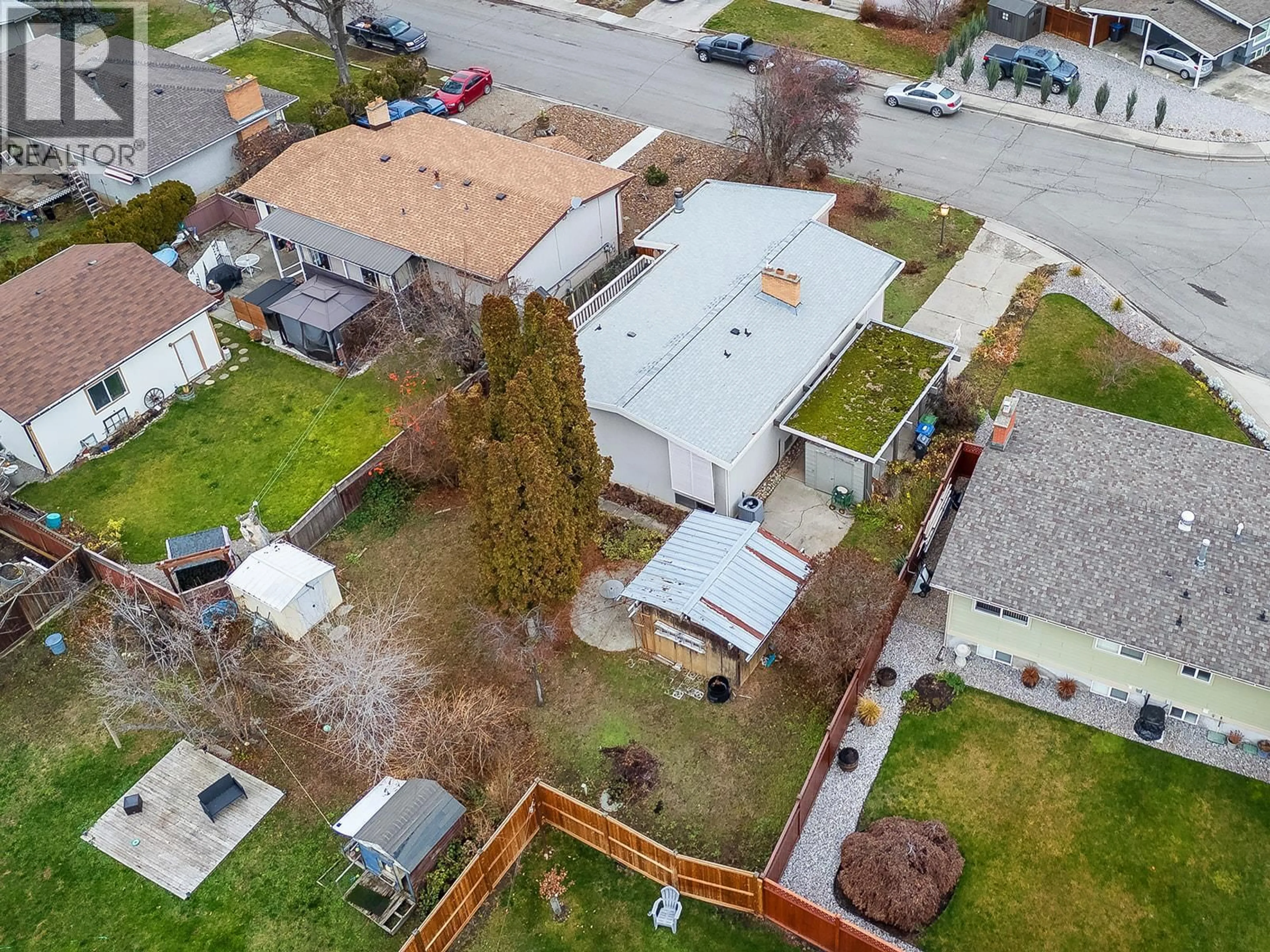 A pic from outside/outdoor area/front of a property/back of a property/a pic from drone, street for 1424 LOMBARDY SQUARE, Kelowna British Columbia V1Y3S7