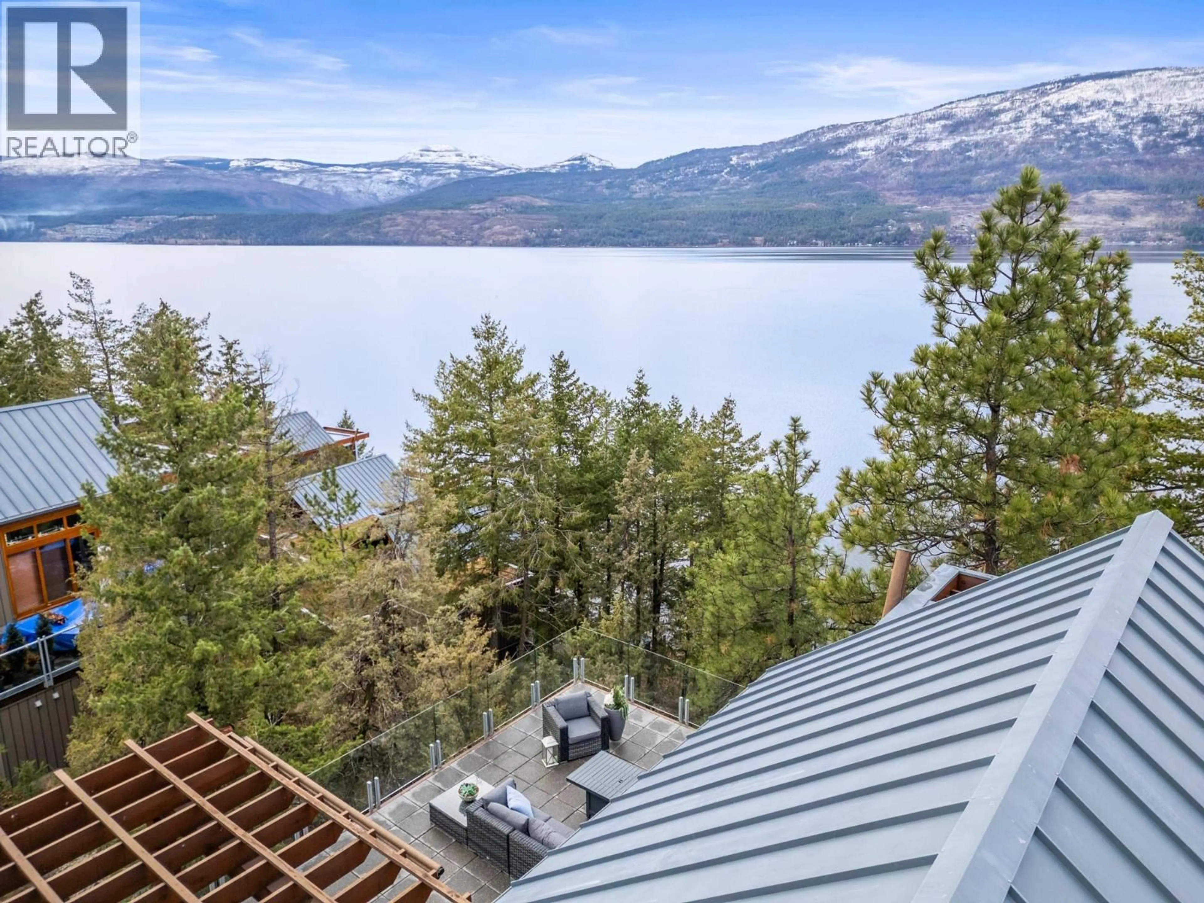 A pic from outside/outdoor area/front of a property/back of a property/a pic from drone, water/lake/river/ocean view for 151 - 9845 EASTSIDE ROAD, Vernon British Columbia V1H1Z2