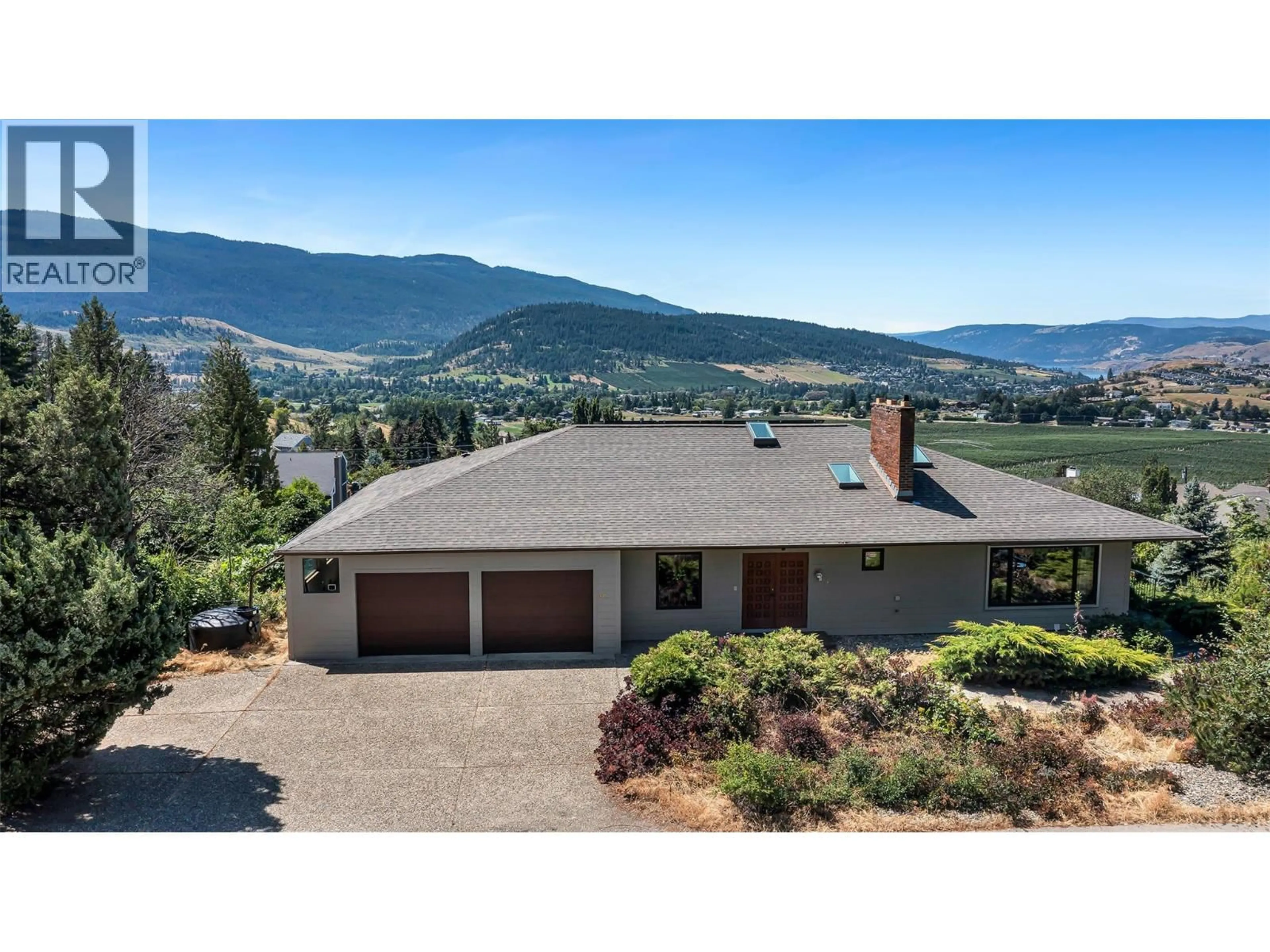 A pic from outside/outdoor area/front of a property/back of a property/a pic from drone, mountain view for 460 CRESTVIEW DRIVE, Coldstream British Columbia V1B2X6