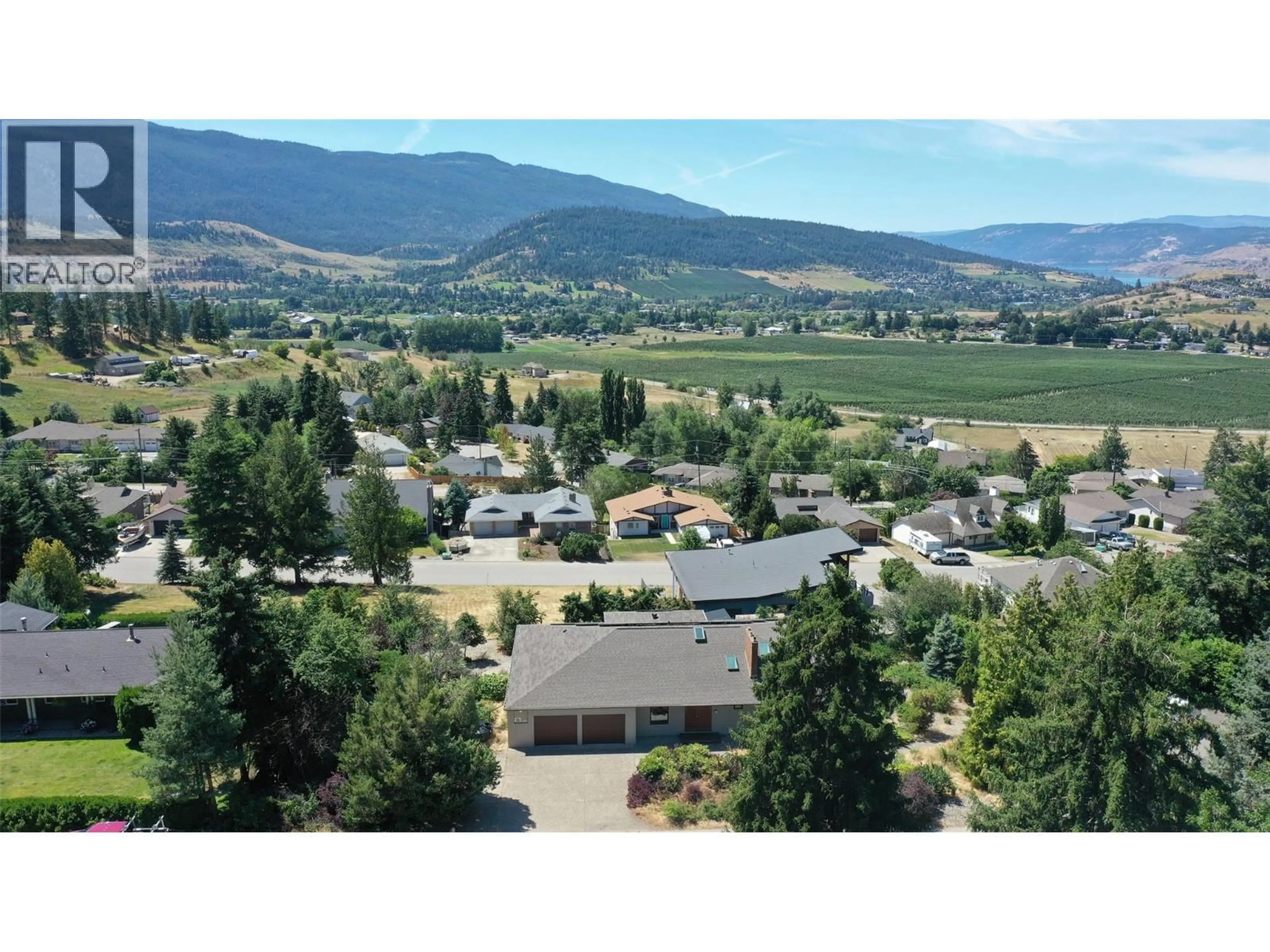 A pic from outside/outdoor area/front of a property/back of a property/a pic from drone, mountain view for 460 CRESTVIEW DRIVE, Coldstream British Columbia V1B2X6
