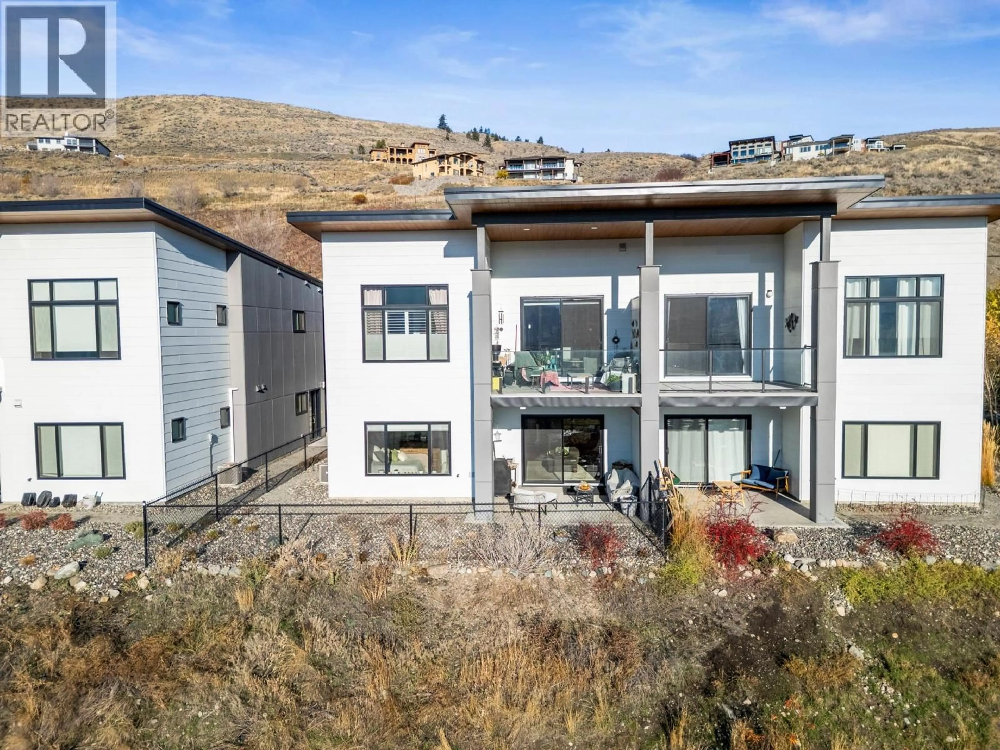 A pic from outside/outdoor area/front of a property/back of a property/a pic from drone, mountain view for 202 VINEYARD WAY, Vernon British Columbia V1H1Z7
