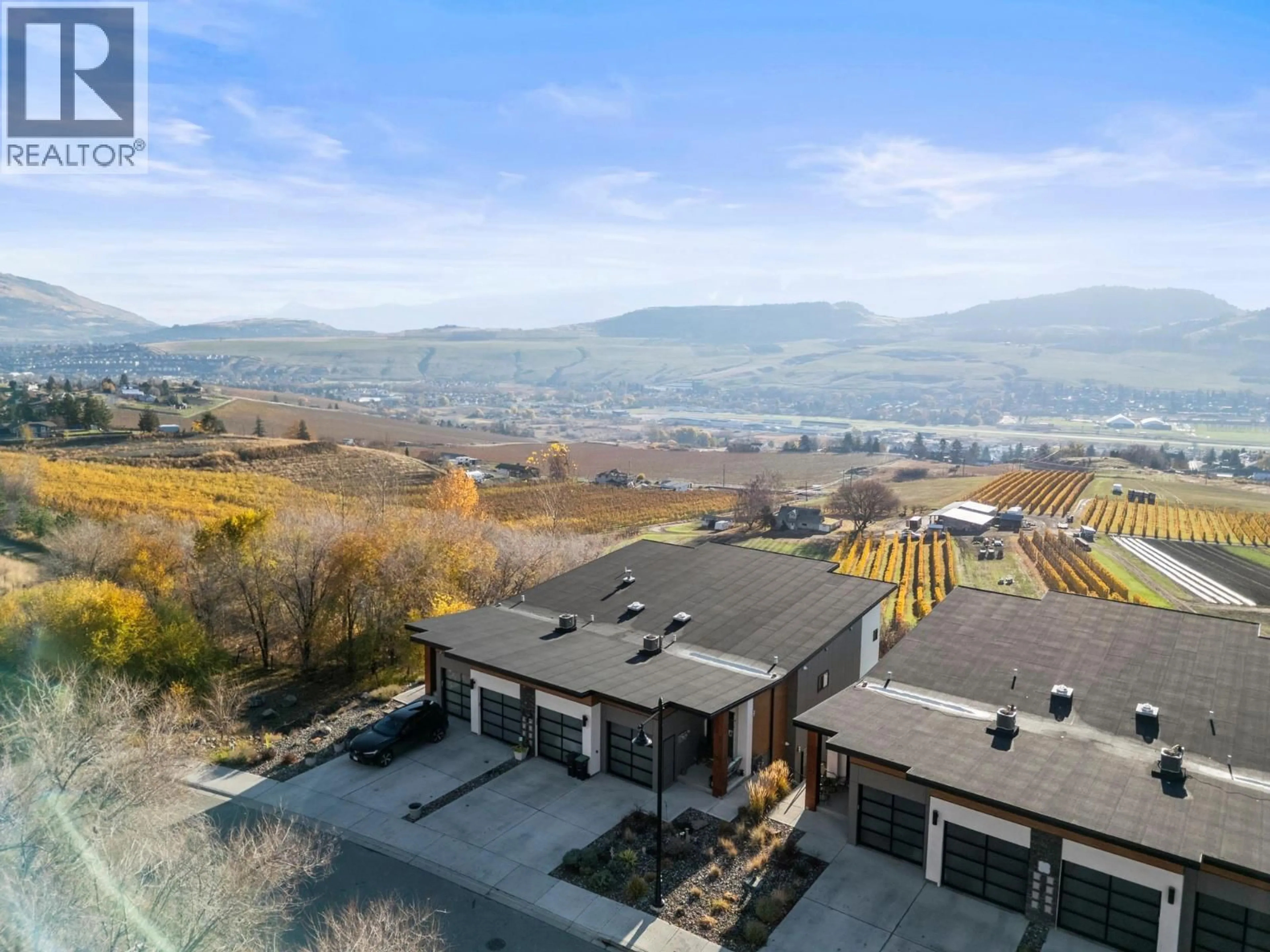 A pic from outside/outdoor area/front of a property/back of a property/a pic from drone, mountain view for 202 VINEYARD WAY, Vernon British Columbia V1H1Z7