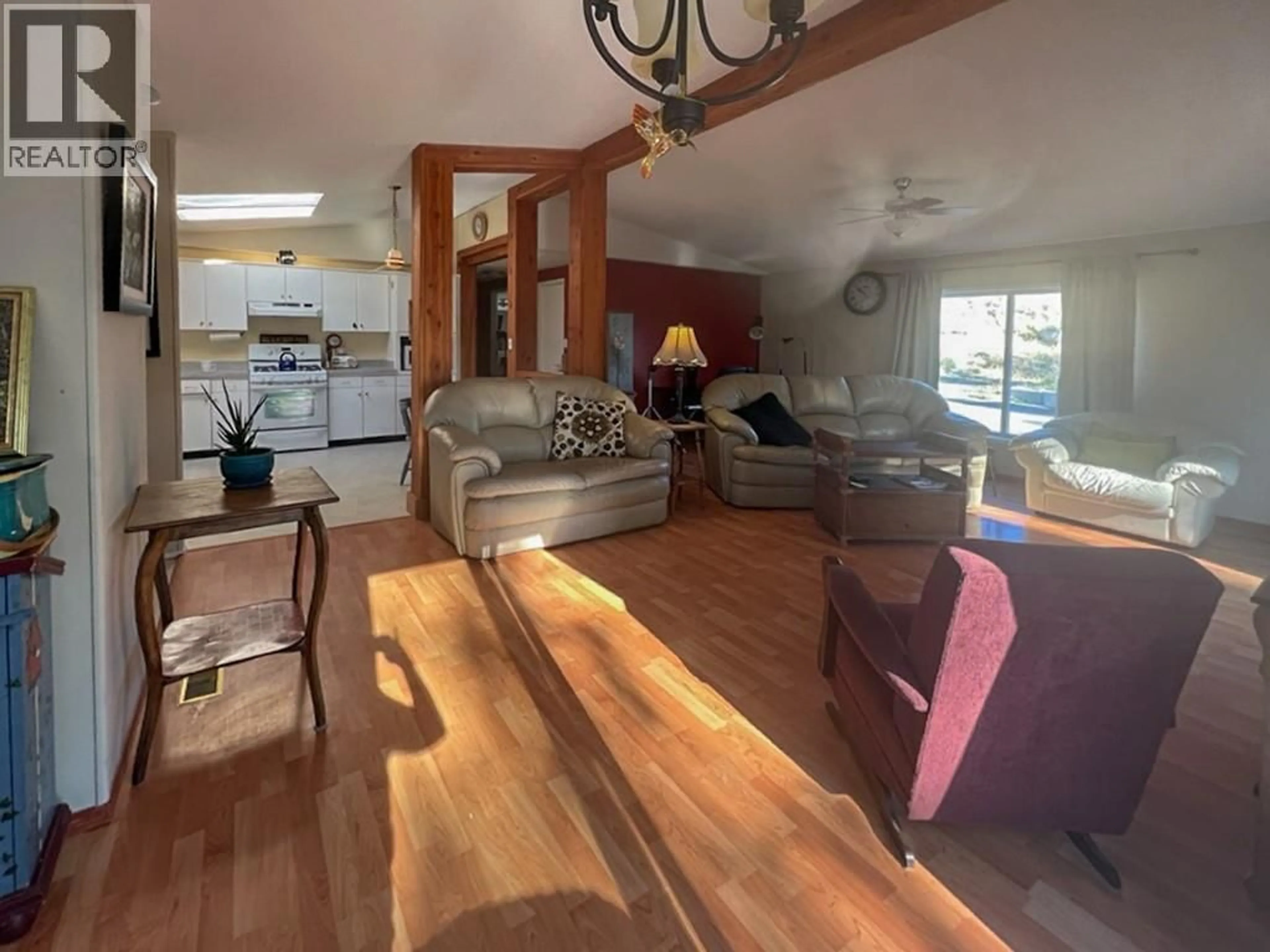 Living room with furniture, wood/laminate floor for 18 - 1401 NICOLA AVENUE, Merritt British Columbia V1K1L8