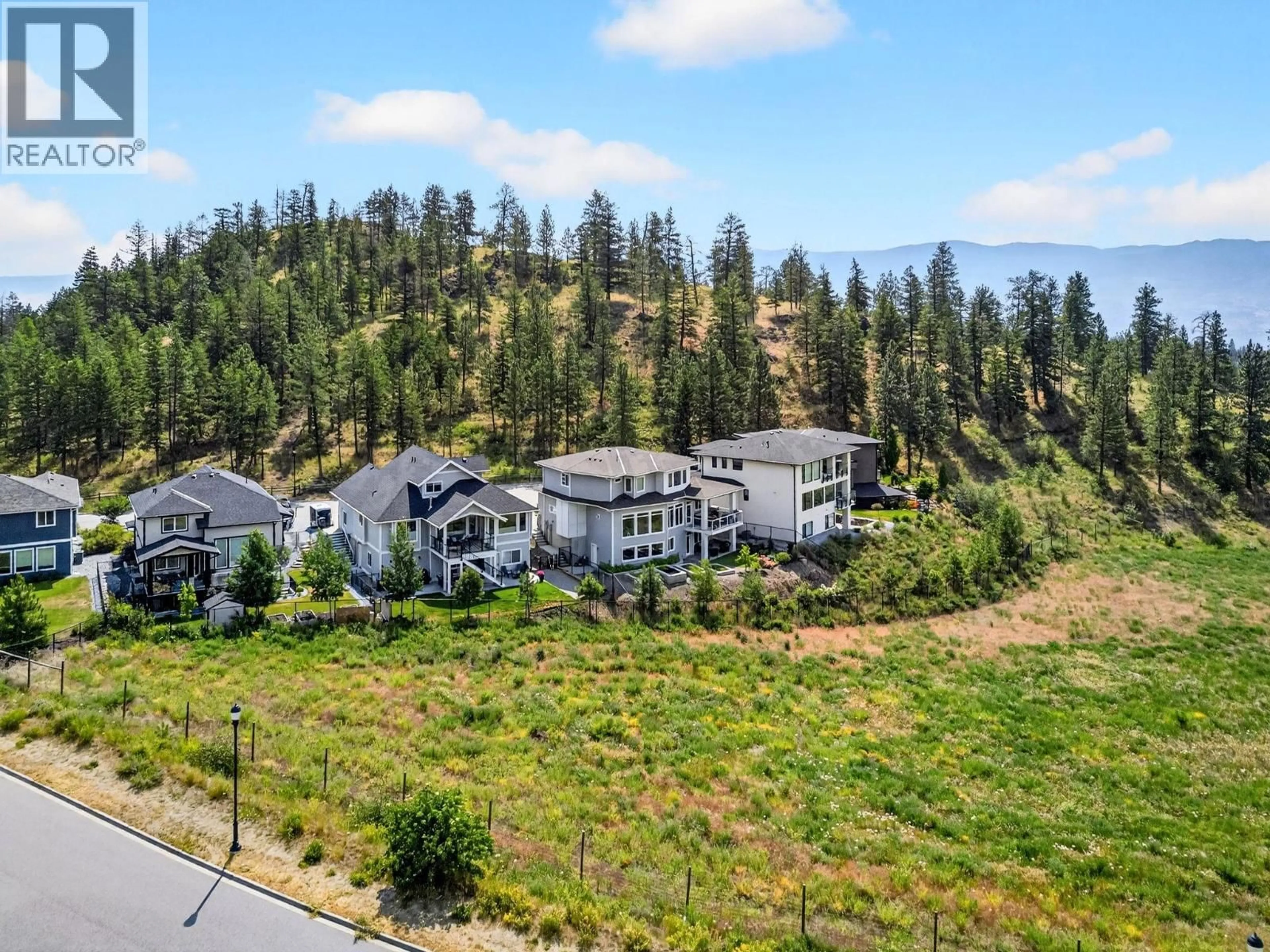 A pic from outside/outdoor area/front of a property/back of a property/a pic from drone, mountain view for 2578 CROWN CREST PLACE, West Kelowna British Columbia V4T3M6