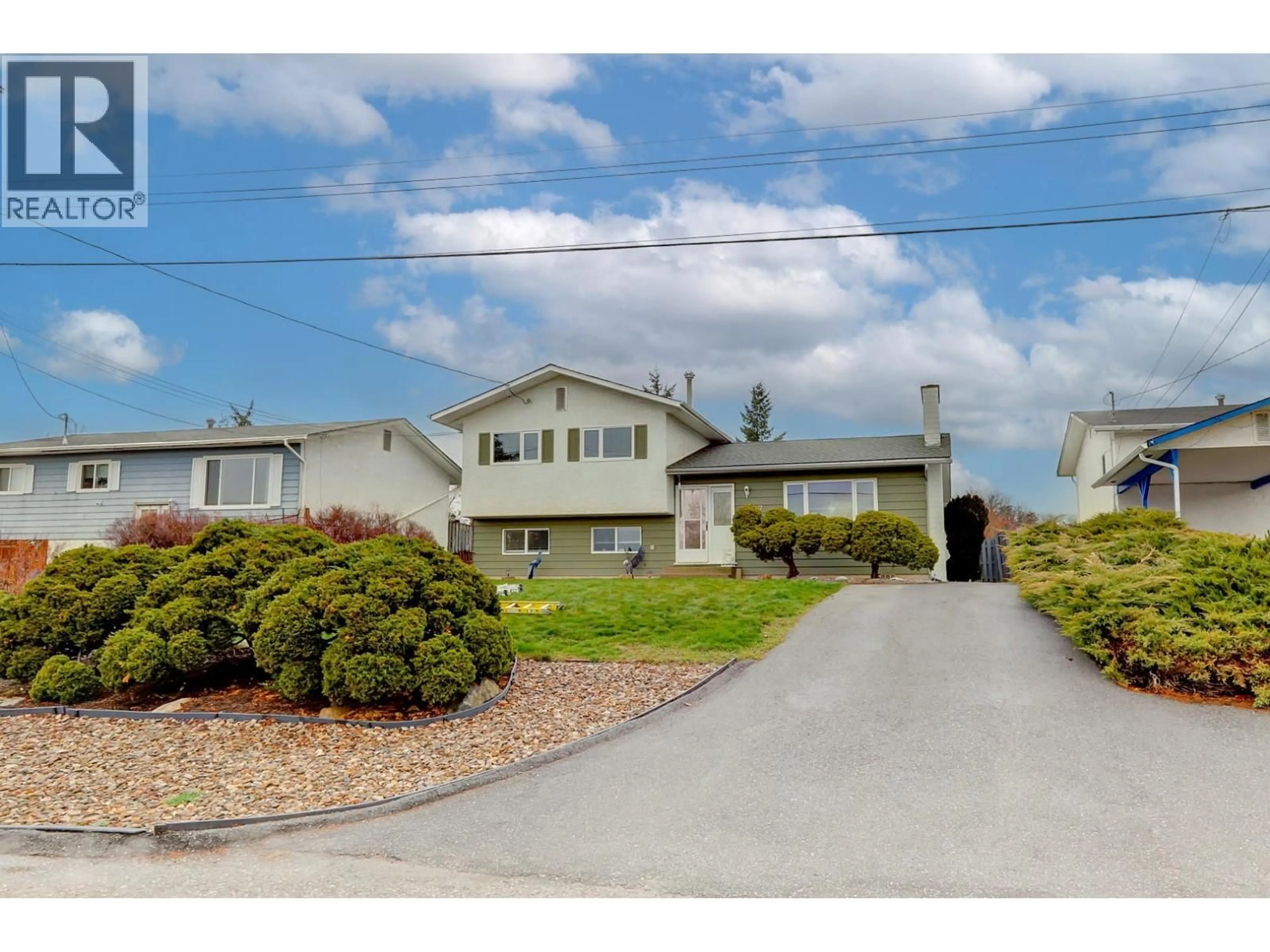 Home with vinyl exterior material, street for 1107 29 AVENUE, Vernon British Columbia V1T1Y4