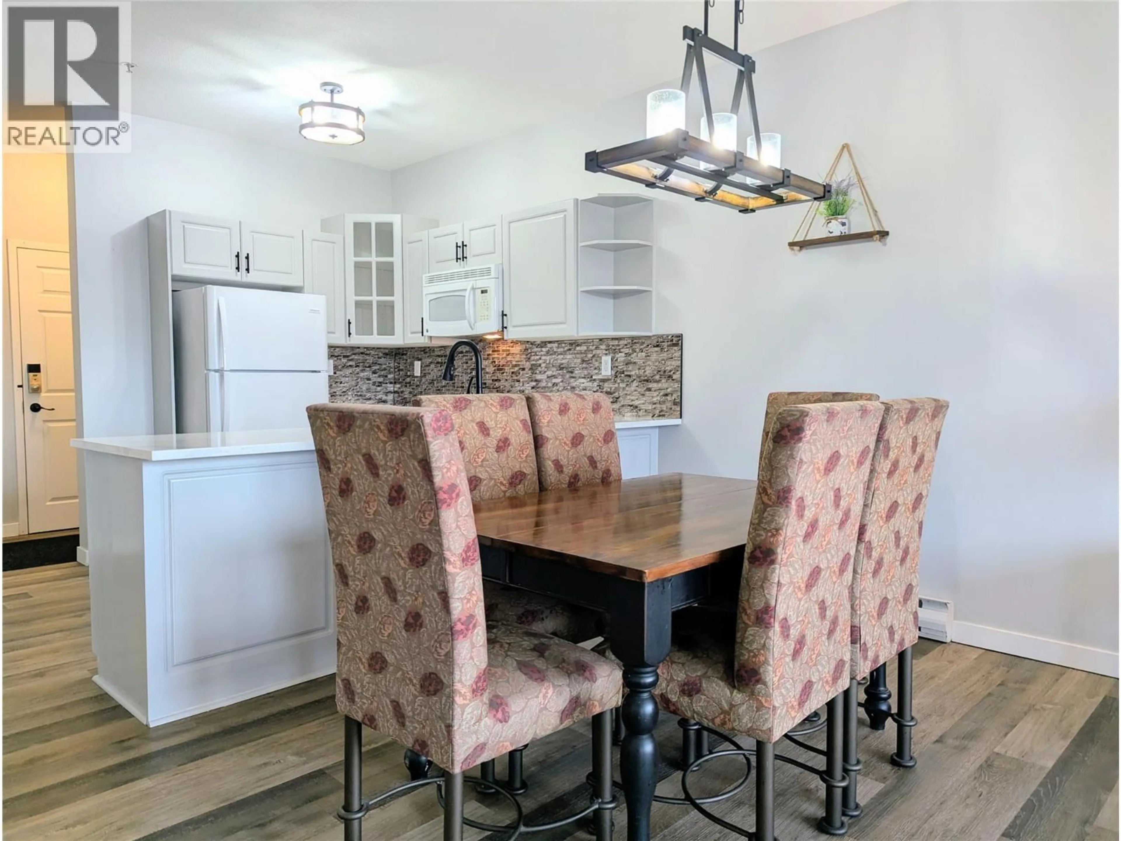 Open concept kitchen, wood/laminate floor for 2008A - 5052 RIVERVIEW ROAD, Fairmont Hot Springs British Columbia V0B1L1