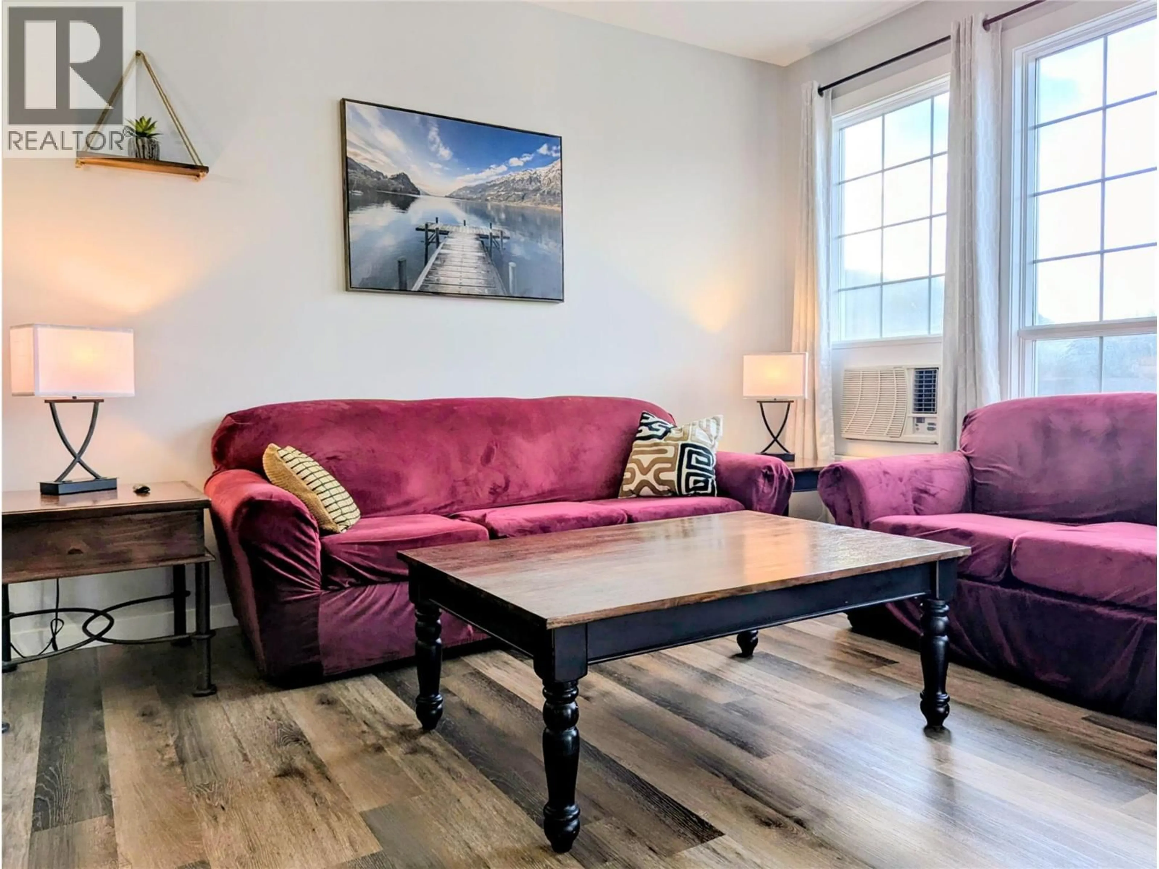 Living room with furniture, wood/laminate floor for 2008A - 5052 RIVERVIEW ROAD, Fairmont Hot Springs British Columbia V0B1L1