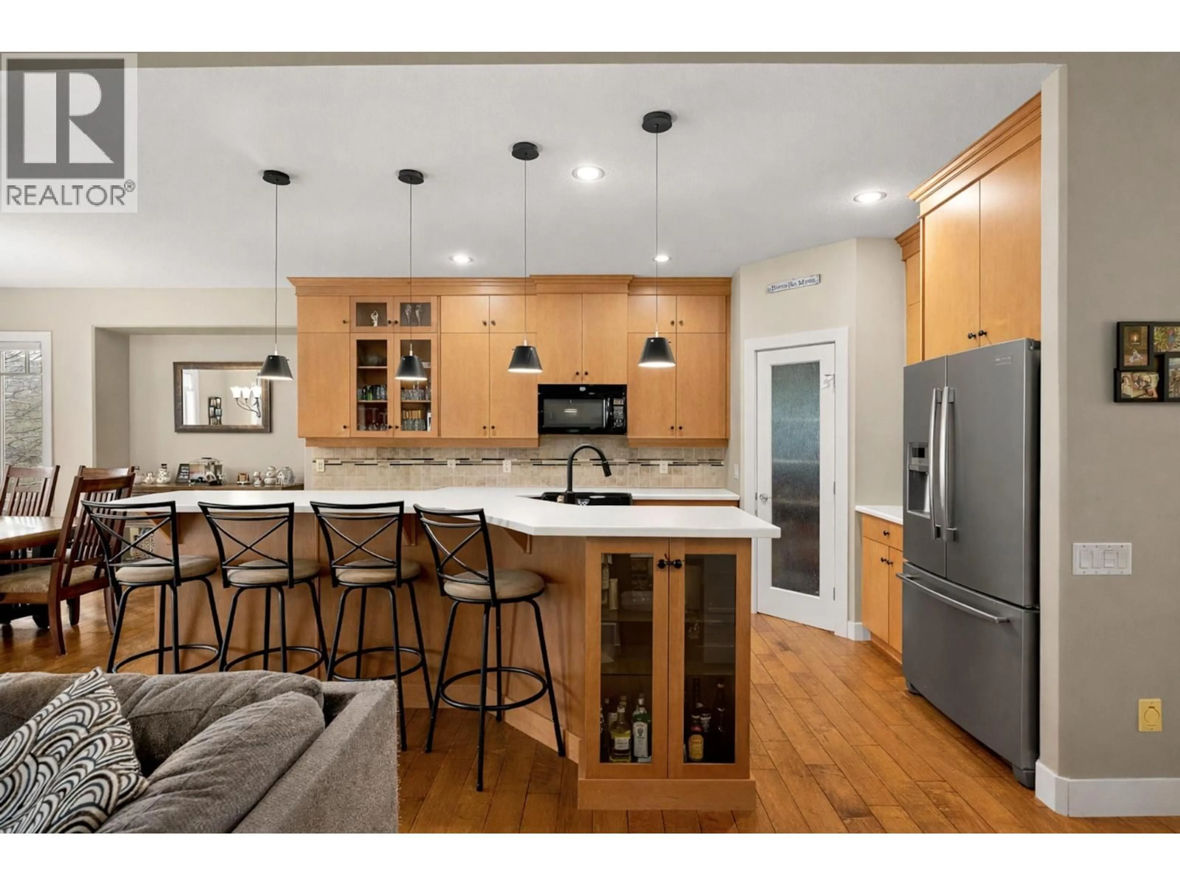 Open concept kitchen, wood/laminate floor for 1601 TOWER RANCH BOULEVARD, Kelowna British Columbia V1P1P9