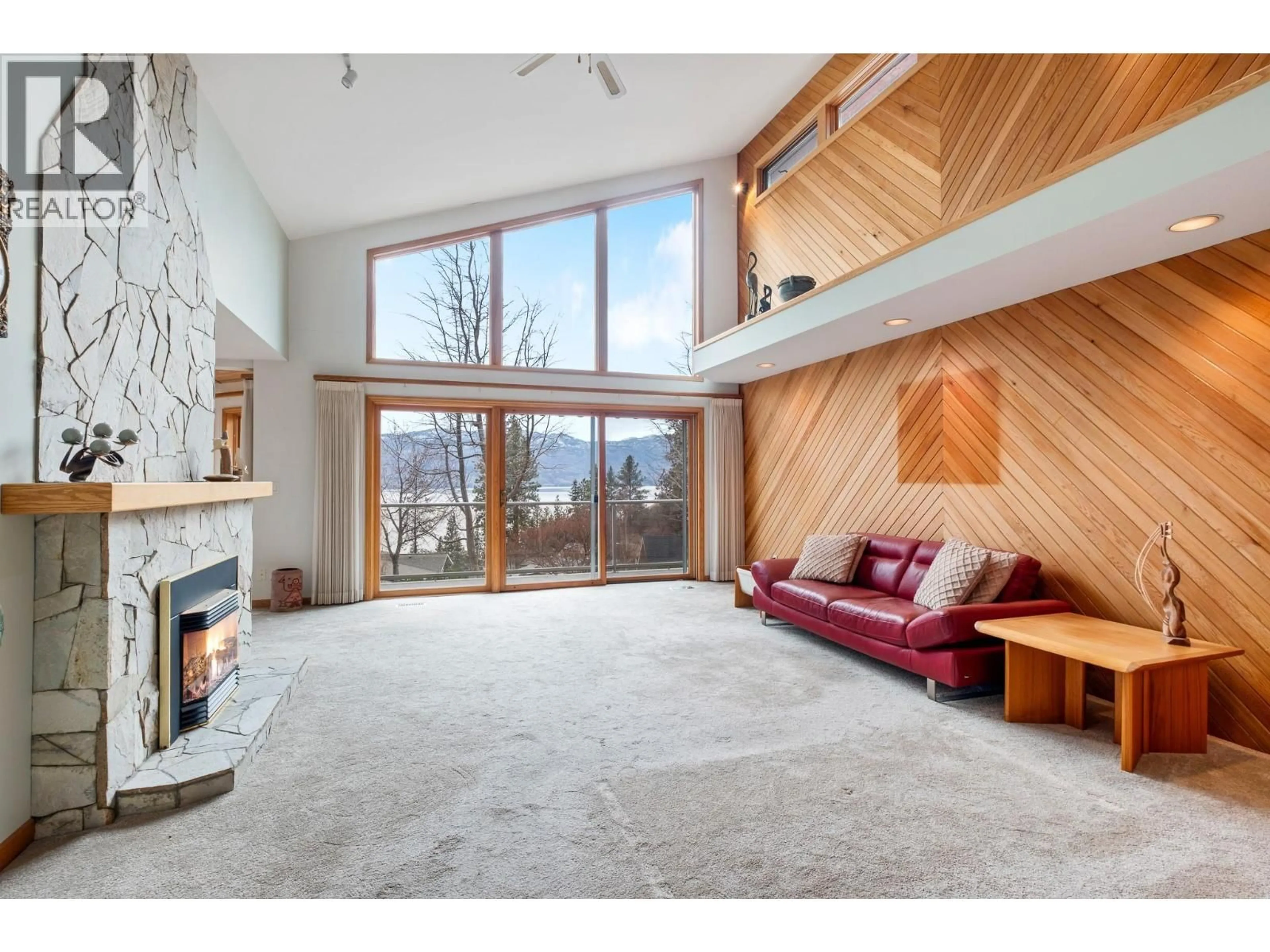 Living room with furniture, wood/laminate floor for 707 BROOKFIELD COURT, West Kelowna British Columbia V1Z3E2