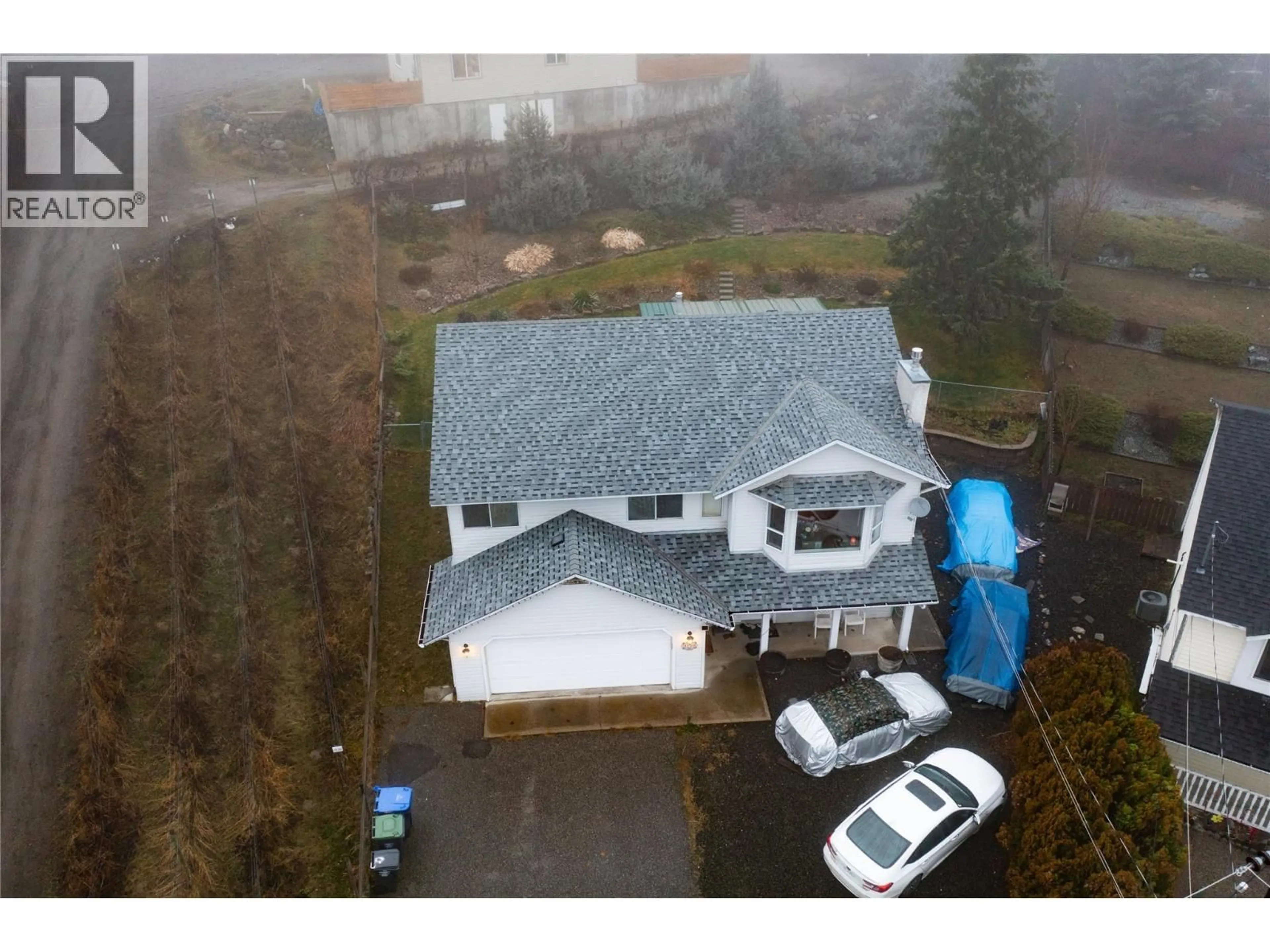 A pic from outside/outdoor area/front of a property/back of a property/a pic from drone, street for 3230 REGENT ROAD, West Kelowna British Columbia V4T1B2