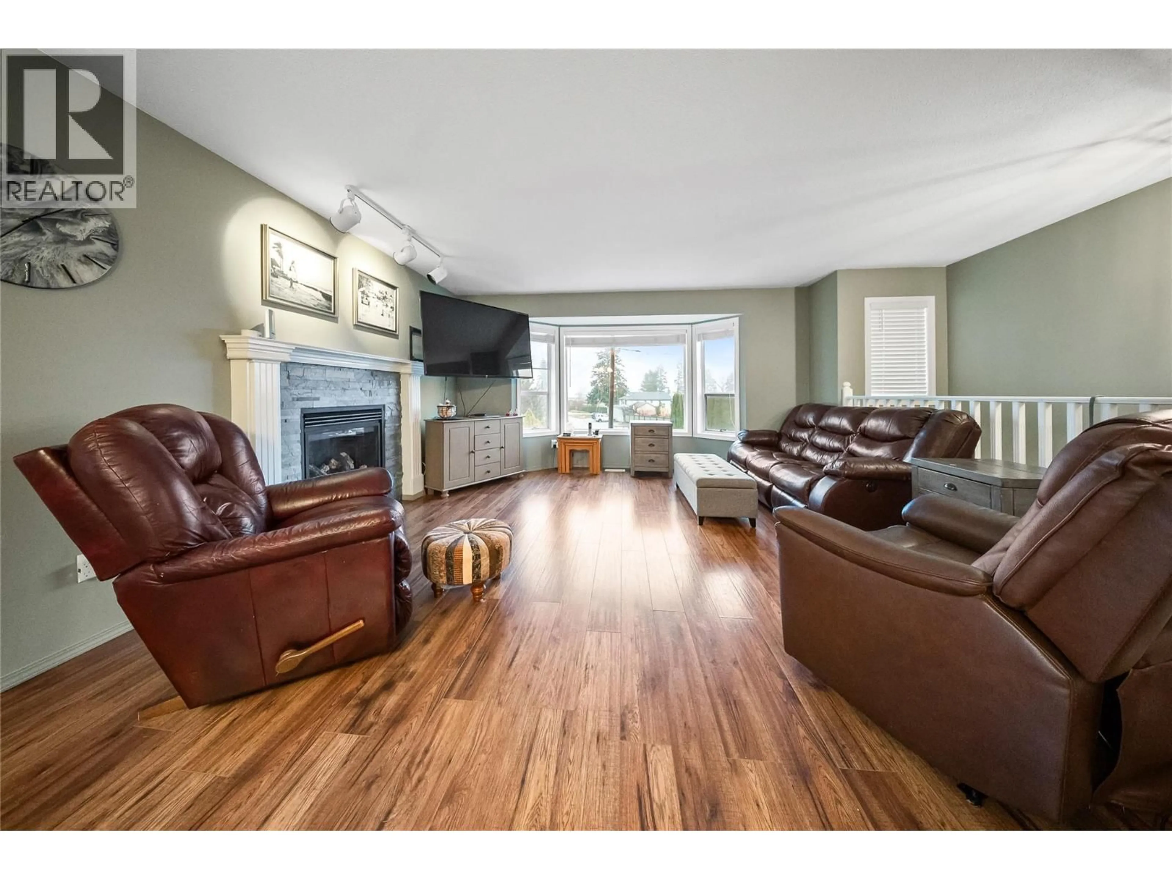 Living room with furniture, wood/laminate floor for 3230 REGENT ROAD, West Kelowna British Columbia V4T1B2