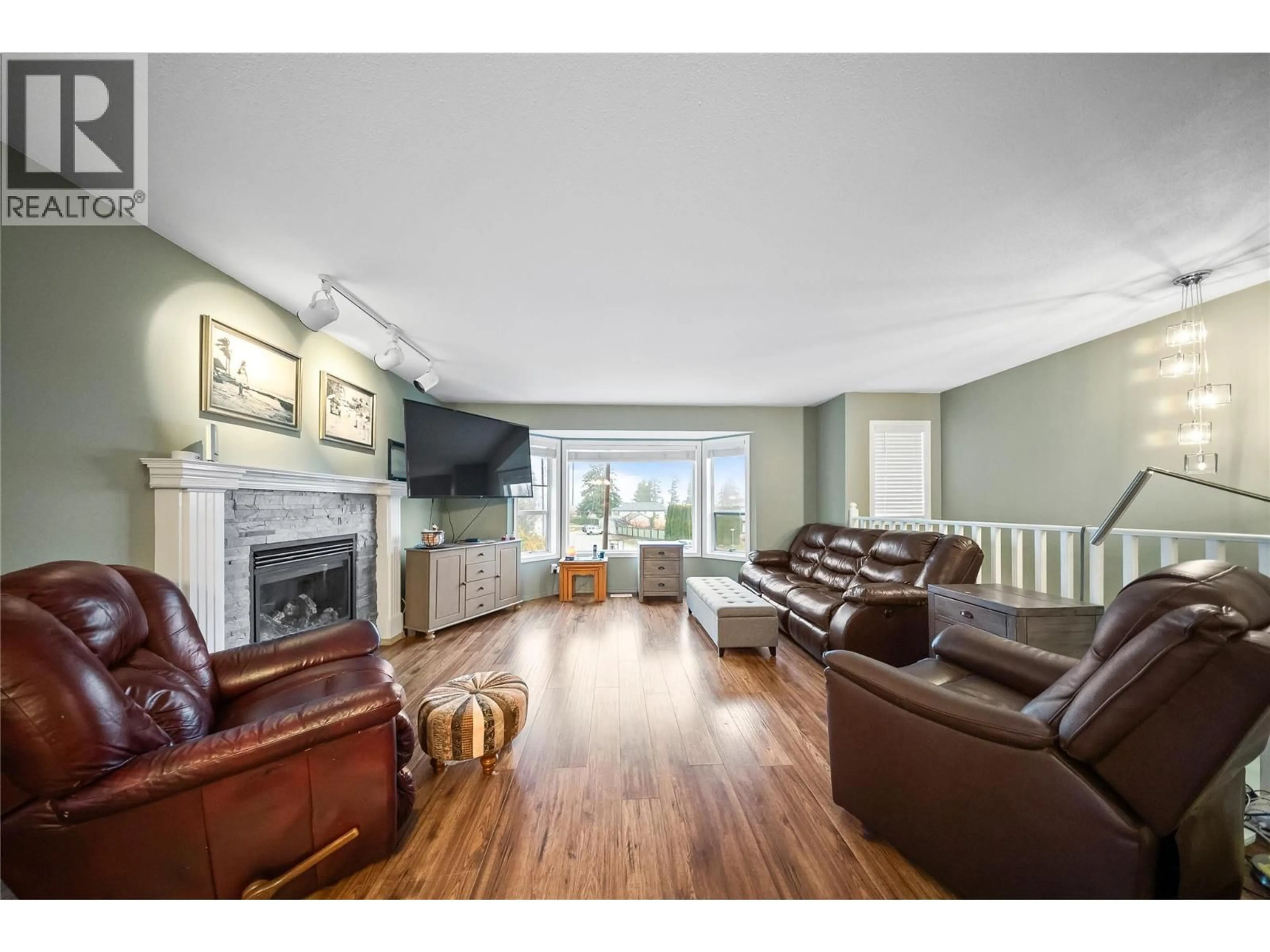 Living room with furniture, wood/laminate floor for 3230 REGENT ROAD, West Kelowna British Columbia V4T1B2