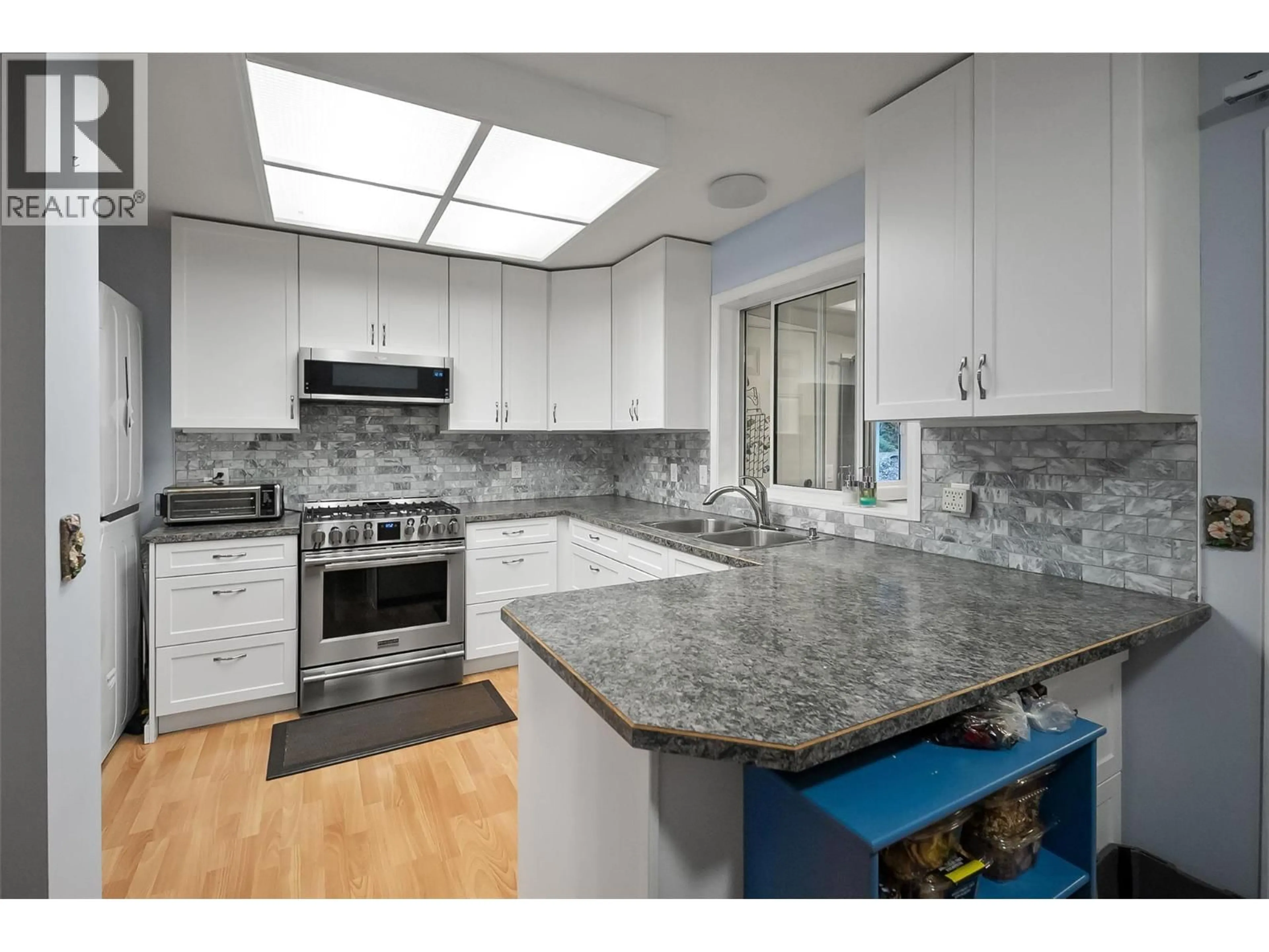 Contemporary kitchen, ceramic/tile floor for 3230 REGENT ROAD, West Kelowna British Columbia V4T1B2