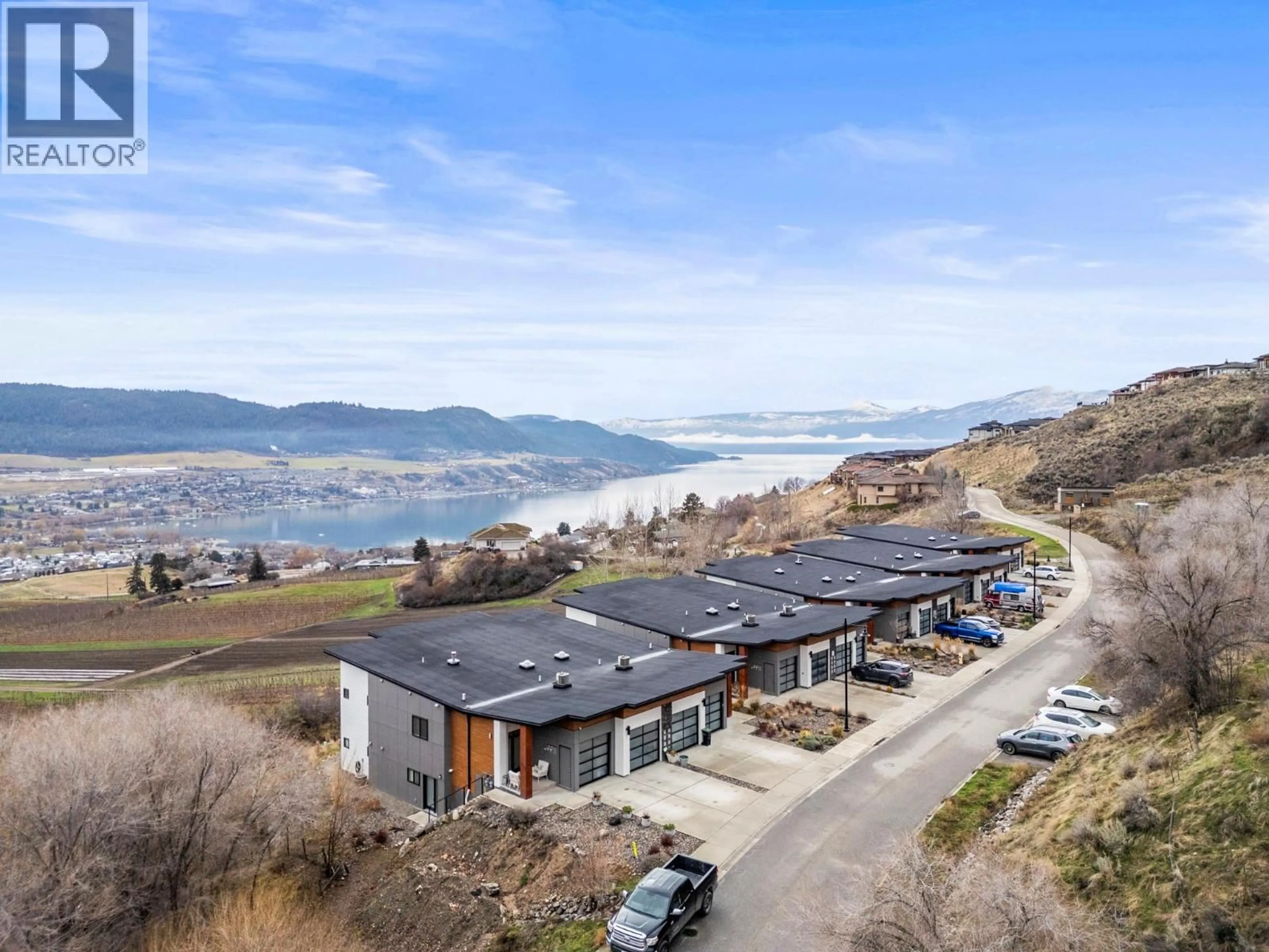 A pic from outside/outdoor area/front of a property/back of a property/a pic from drone, water/lake/river/ocean view for 204 VINEYARD WAY, Vernon British Columbia V1H1Z7