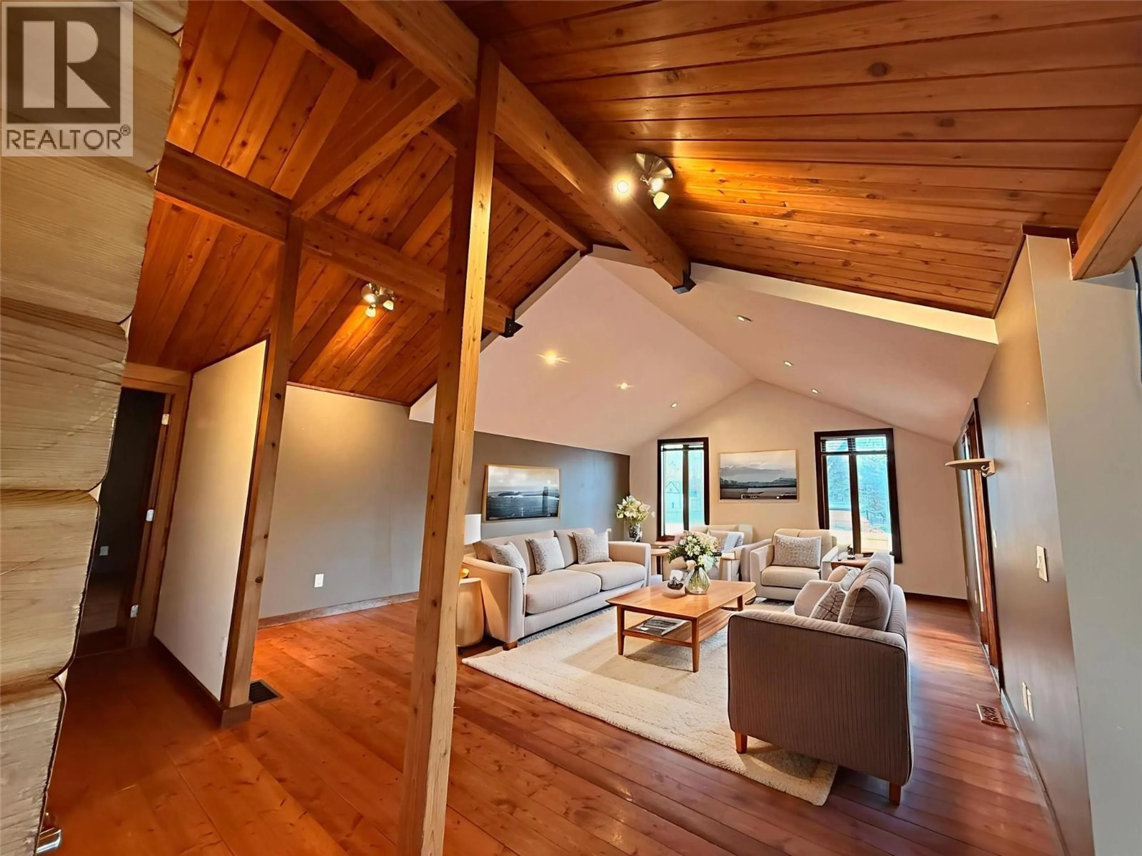Living room with furniture, wood/laminate floor for 9209 WALLIS AVENUE, Wilmer British Columbia V0A1K5