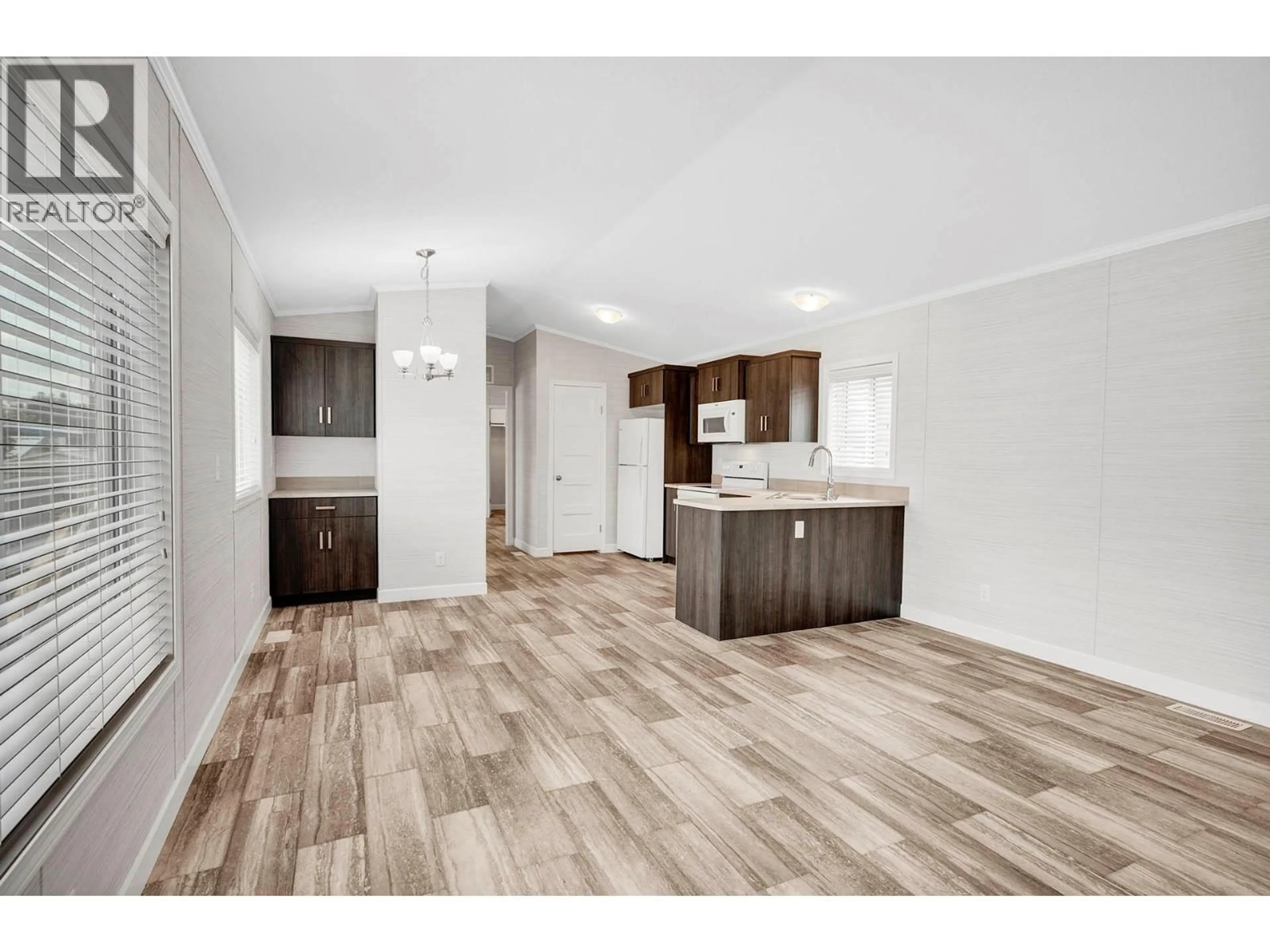 Open concept kitchen, wood/laminate floor for 168 - 2400 OAKDALE WAY, Kamloops British Columbia V2B6W7