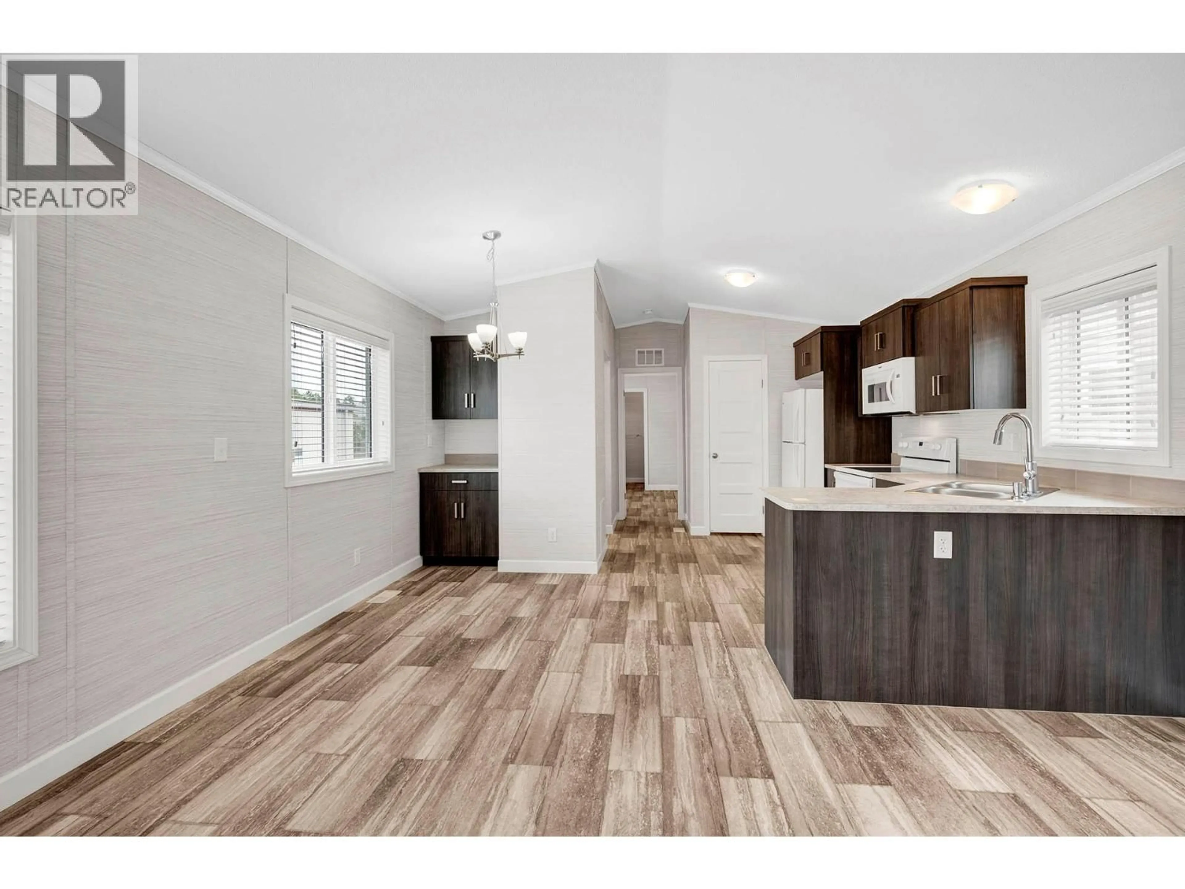 Open concept kitchen, wood/laminate floor for 168 - 2400 OAKDALE WAY, Kamloops British Columbia V2B6W7