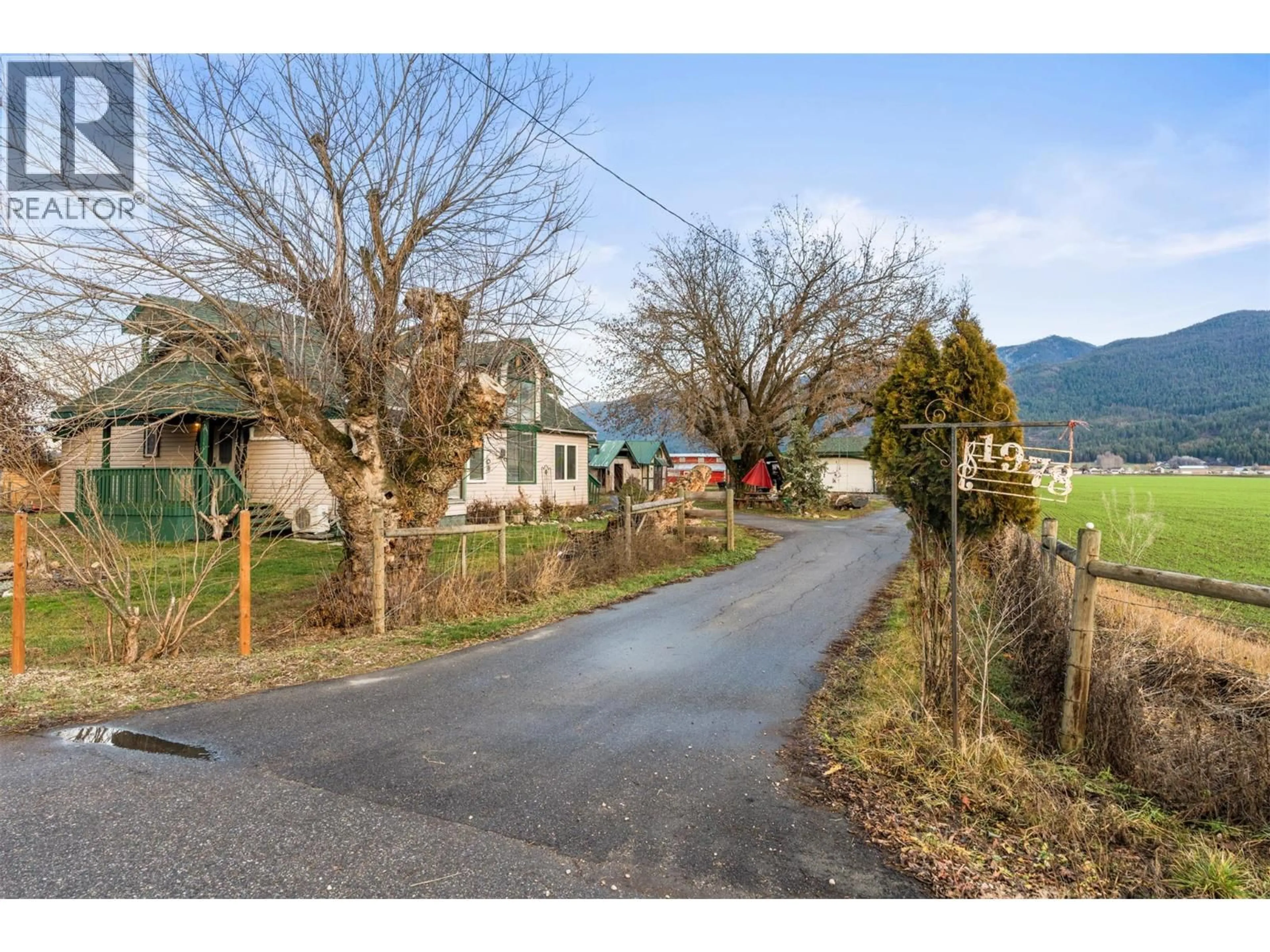 A pic from outside/outdoor area/front of a property/back of a property/a pic from drone, street for 1978 PLEASANT VALLEY ROAD, Spallumcheen British Columbia V4Y0T7