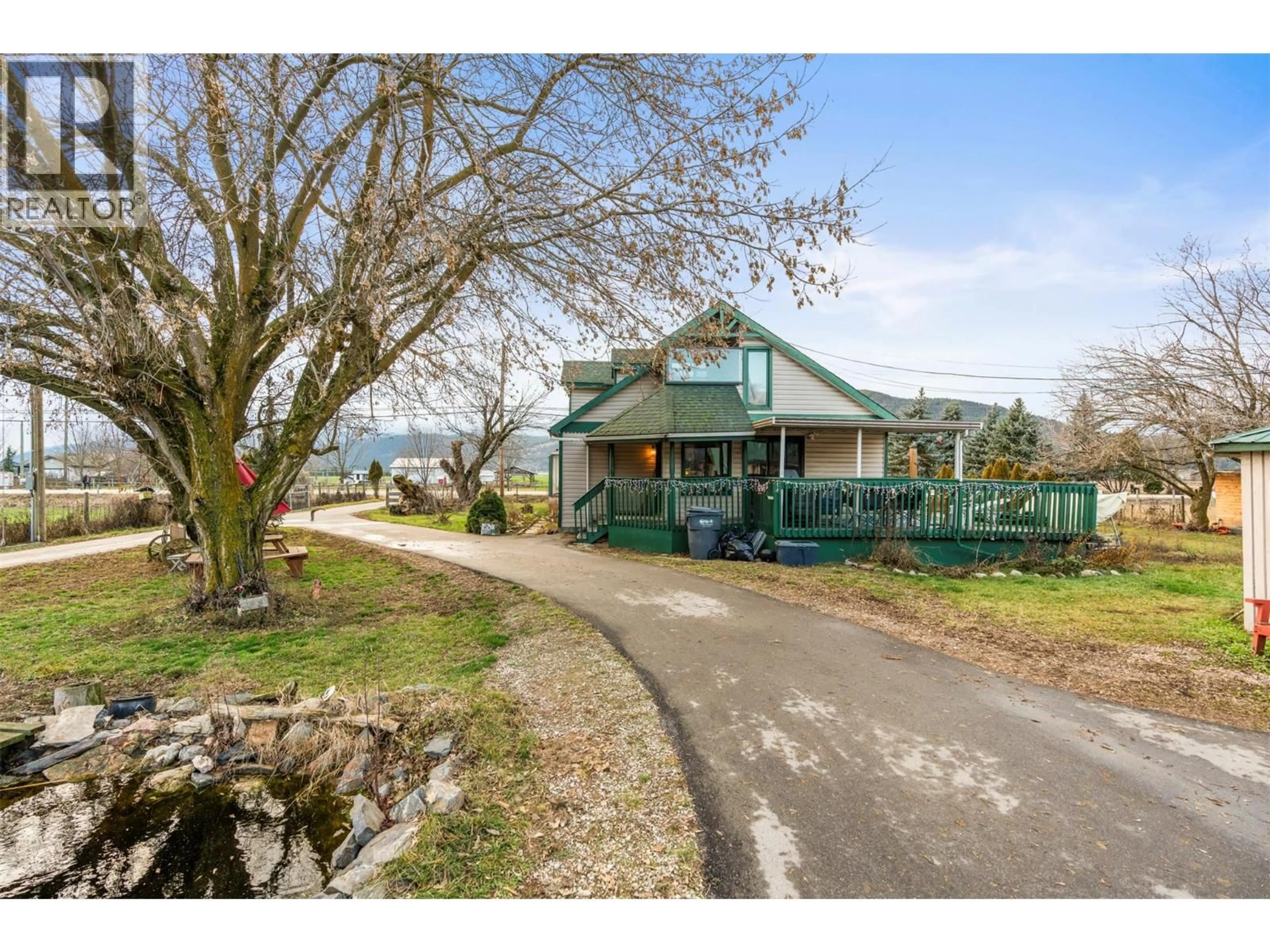A pic from outside/outdoor area/front of a property/back of a property/a pic from drone, street for 1978 PLEASANT VALLEY ROAD, Spallumcheen British Columbia V4Y0T7