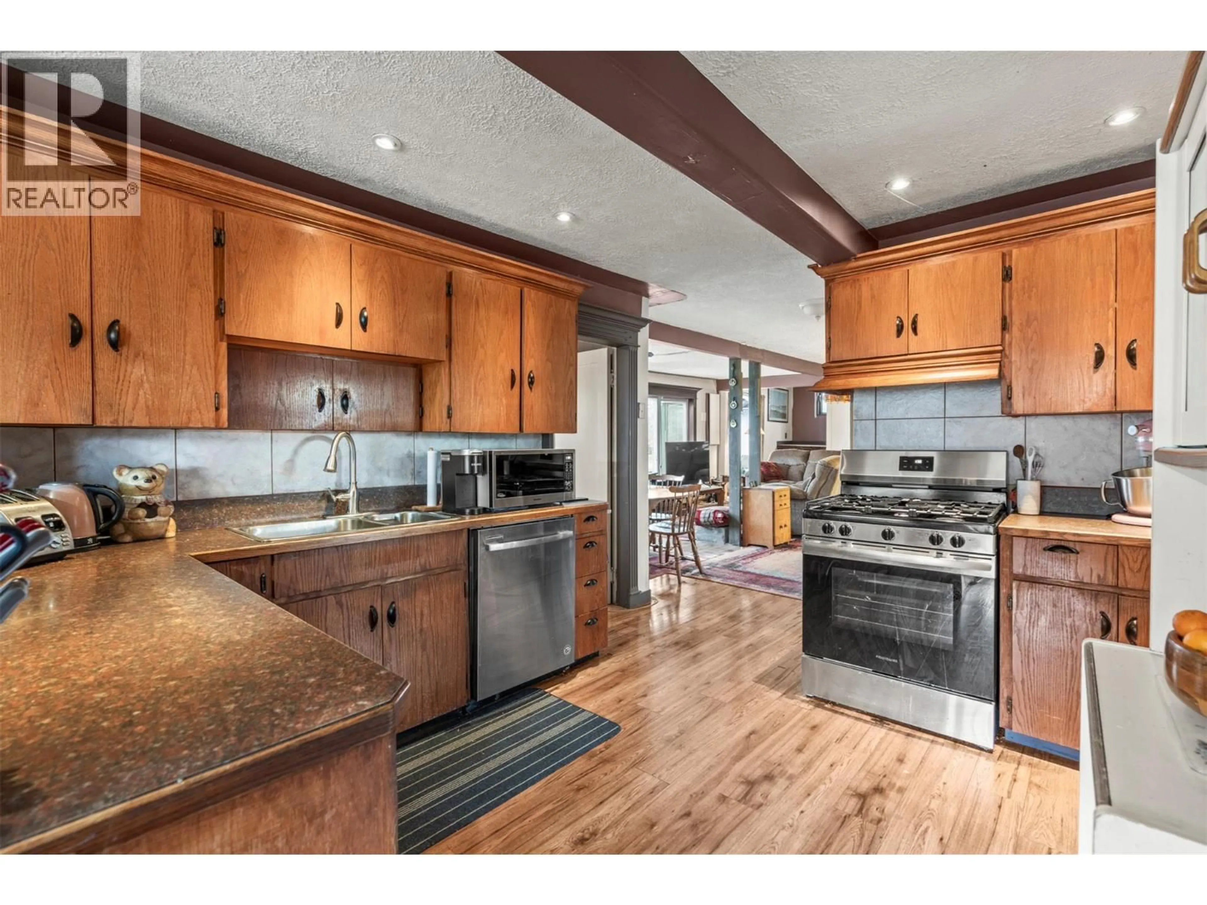 Open concept kitchen, wood/laminate floor for 1978 PLEASANT VALLEY ROAD, Spallumcheen British Columbia V4Y0T7