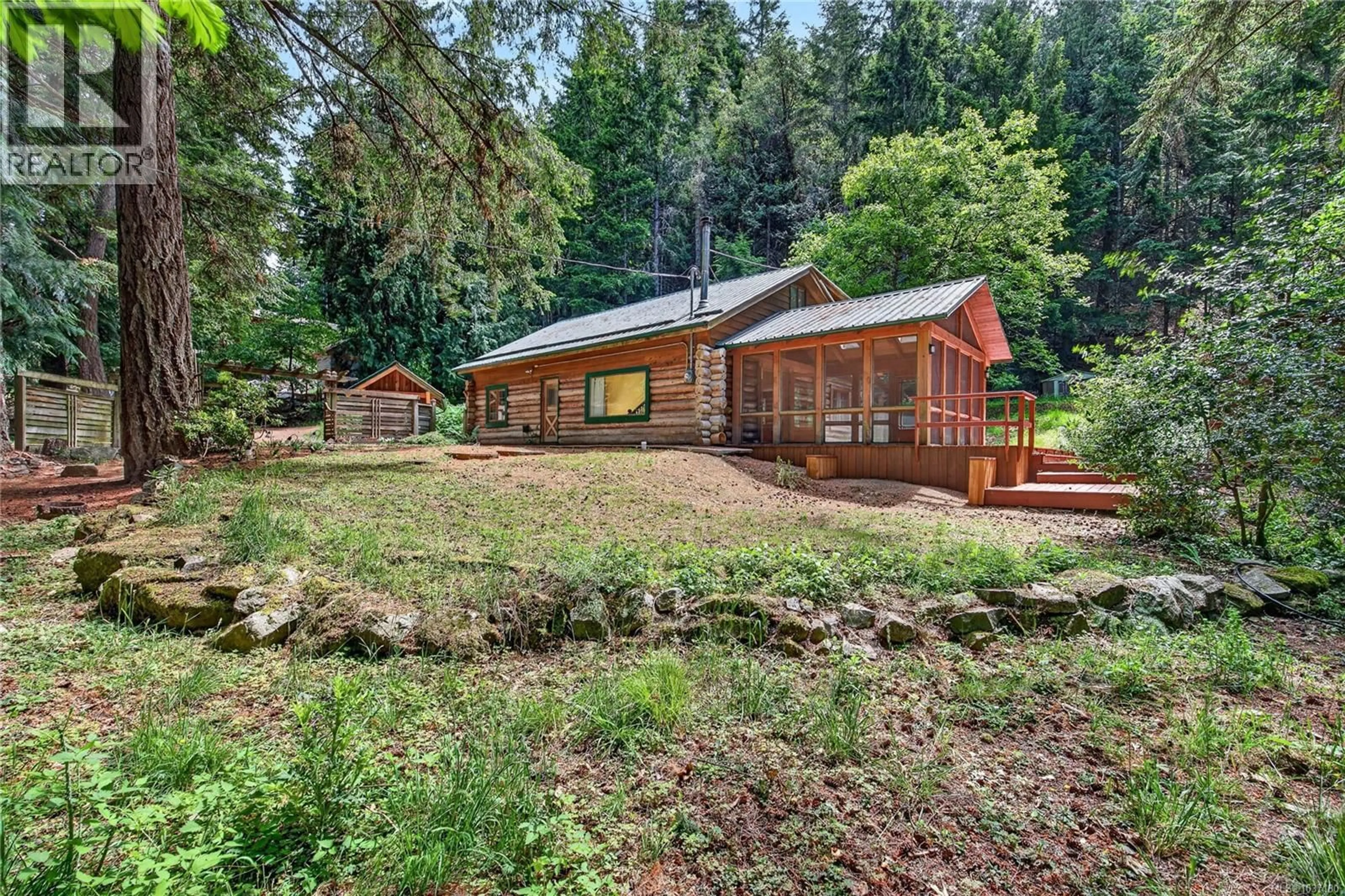 A pic from outside/outdoor area/front of a property/back of a property/a pic from drone, forest/trees view for 135 FAIRWAY DRIVE, Salt Spring British Columbia V8K1M6